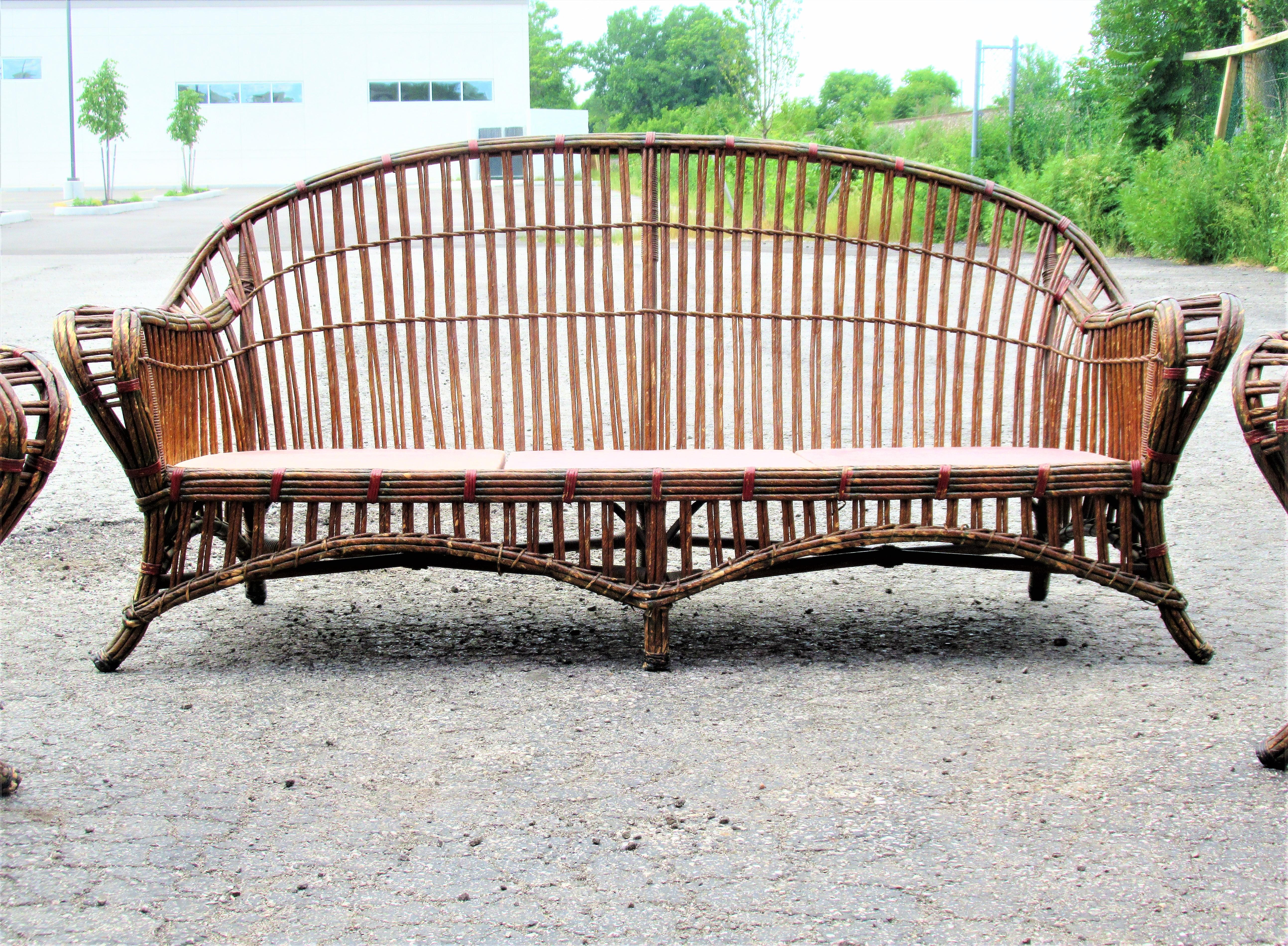 1930s American Art Deco matching three piece wicker set consisting of three seat sofa and two armchairs. Manufactured by Karpen Furniture, Chicago, Michigan City and New York - see label and metal tag. The set is in overall beautifully aged color to