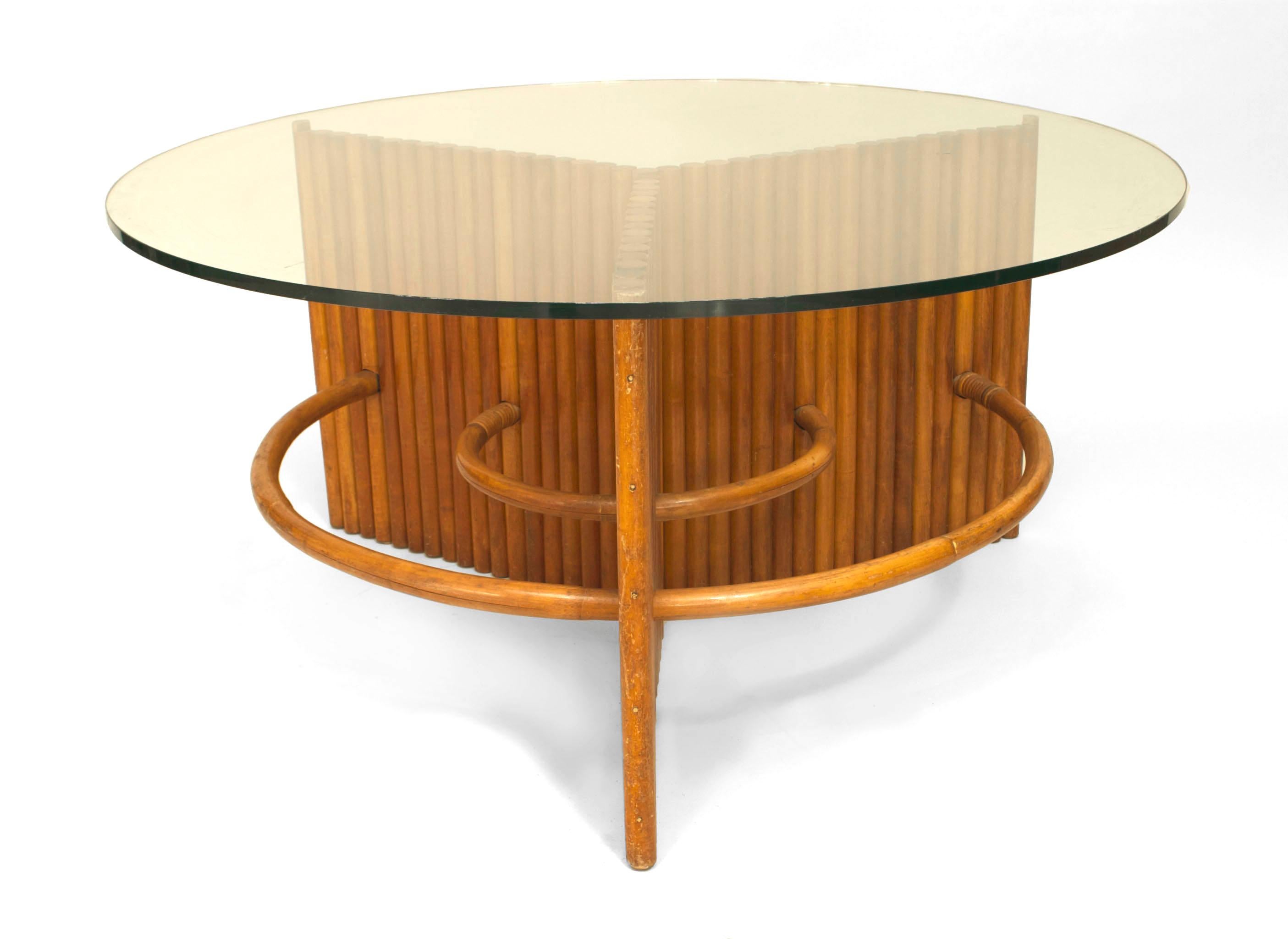 American Art Moderne (1930s) coffee table with a slat pine faux bamboo-style base and a round glass top. (attributed to: PAUL FRANKL)
