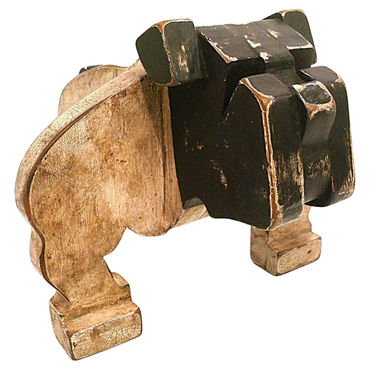 1930's American Folk Art Wooden Bulldog Sculpture.
This is a wonderful Primitive Folk Art bull bog. A close look at the simplicity of design and construction tells you this was an accomplished artist. It's over 90 years old and still feels