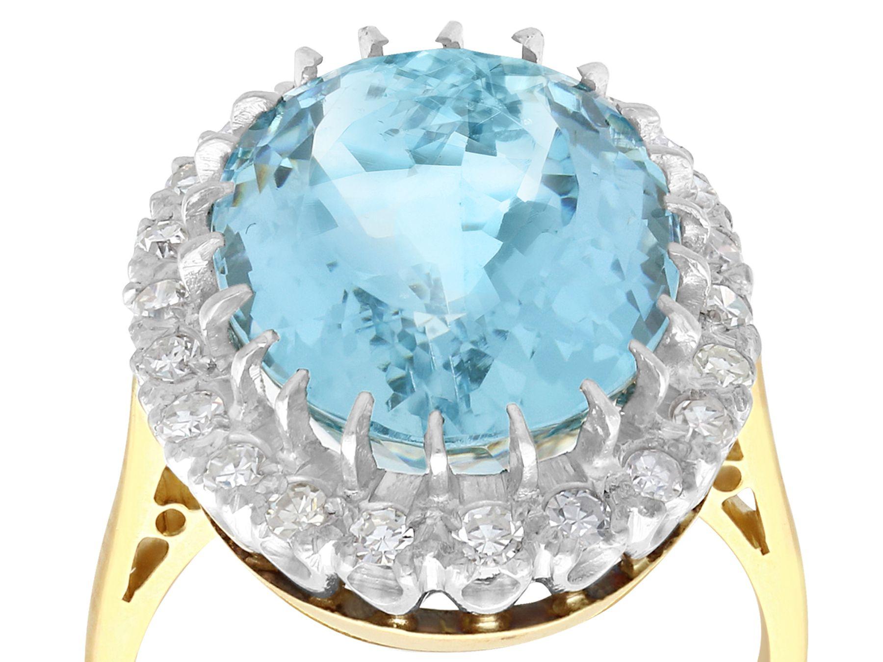 A stunning, fine and impressive antique 10.79 carat aquamarine and 0.66 carat diamond, 18 karat yellow gold and 18k white gold set cocktail ring; part of our diverse aquamarine jewelry and estate jewelry collections

This stunning antique aquamarine