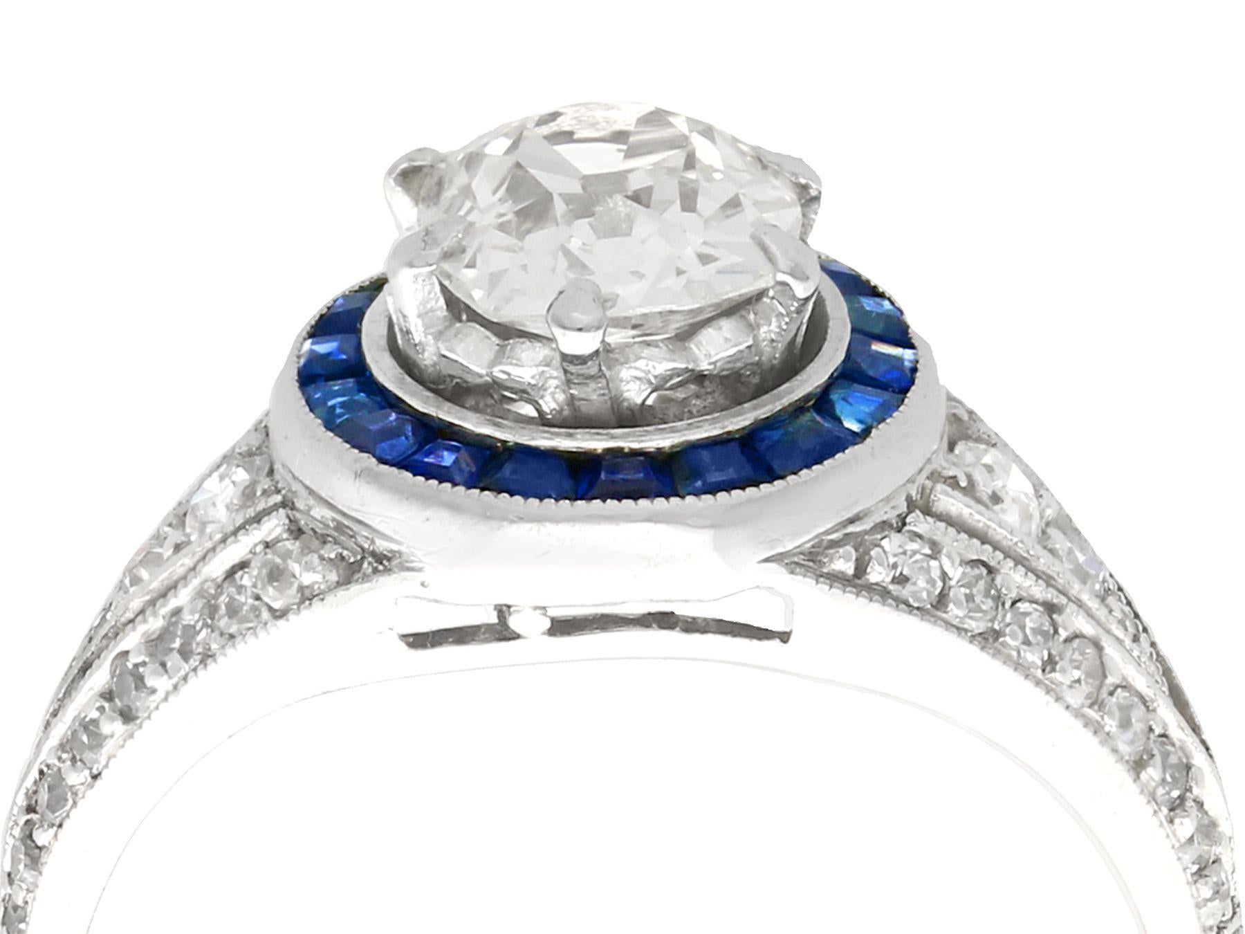 A stunning, fine and impressive antique 1930s 2.59 carat (total) Old European cut diamond, 0.48 carat sapphire and platinum cocktail ring; part of our diverse antique jewelry and estate jewelry collections.

This stunning antique diamond ring has