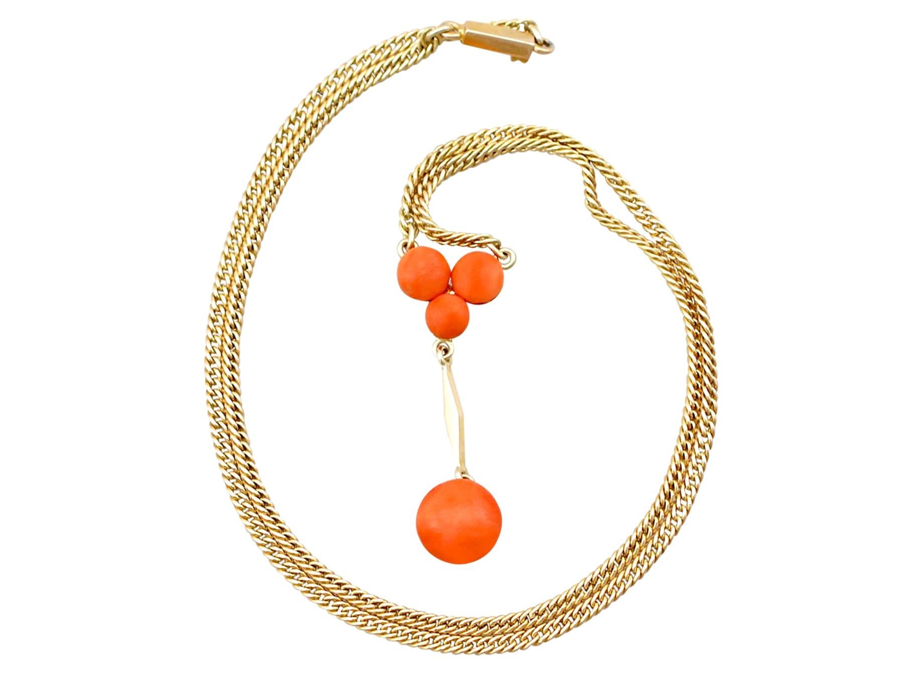 An impressive antique 1930s 2.72 carat coral and 14 karat yellow gold necklace; part of our diverse antique jewelry and estate jewelry collections.

This fine and impressive antique coral necklace has been crafted in 14k yellow gold.

The pendant is