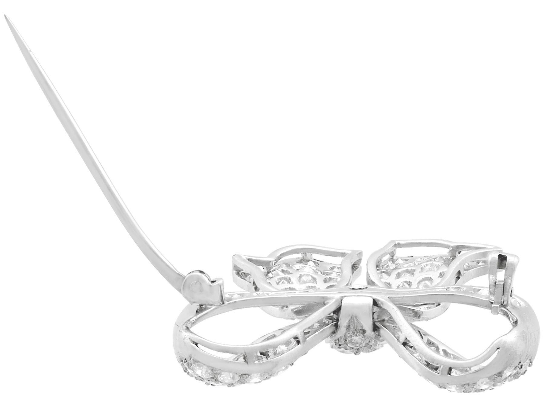 Round Cut 1930s Antique 2.85 Carat Diamond and Platinum Bow Brooch For Sale