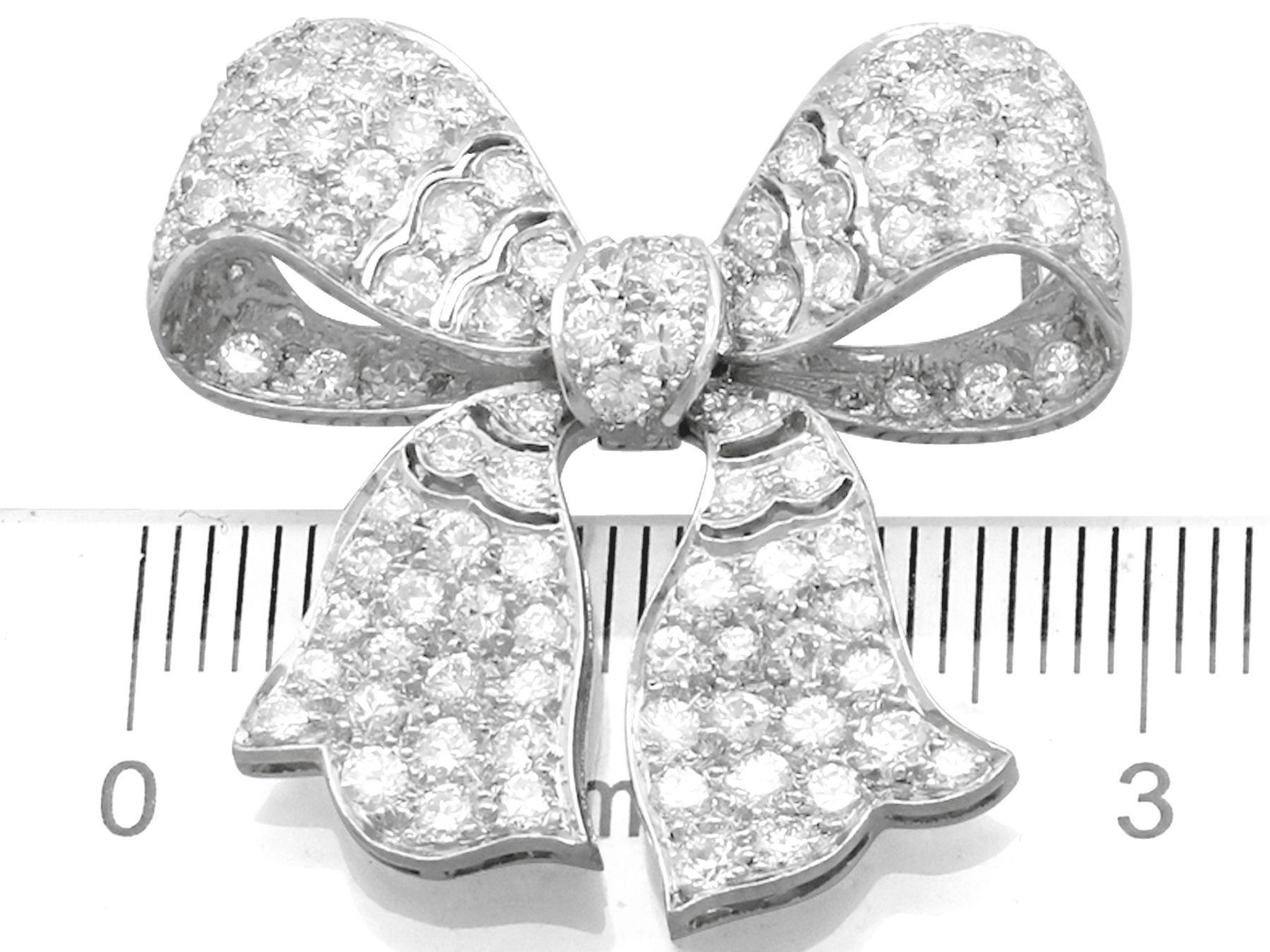 Round Cut 1930s Antique 2.85 Carat Diamond and Platinum Bow Brooch For Sale