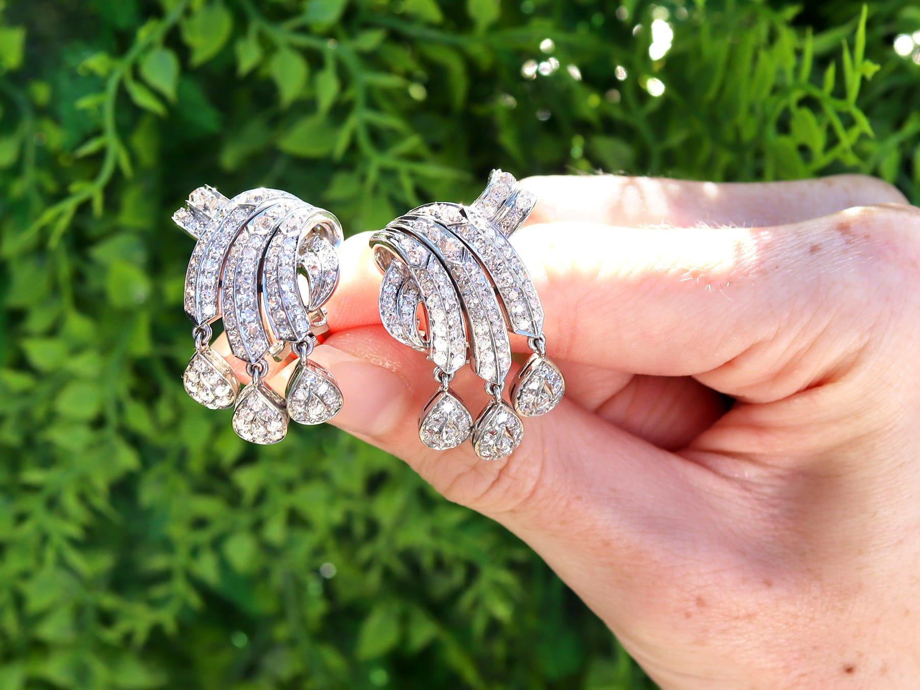 A stunning, fine and impressive pair of antique 4.26 carat diamond and platinum drop earrings; part of our diamond jewellery collections

These excellent drop earrings have been crafted in platinum.

Each opposing earring has an asymmetric