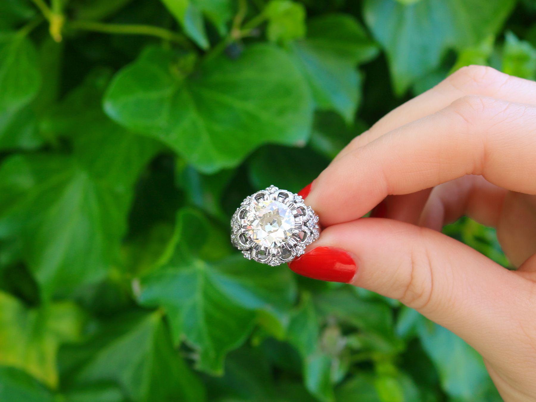 A stunning, fine, and impressive antique 4.31 carat diamond cluster ring in platinum; part of our collection of antique diamond rings.

This stunning, fine, and impressive antique diamond ring has been crafted in platinum.

The platinum pierced