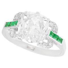 1930s Antique 4.42 Carat Diamond and Emerald White Gold Cocktail Ring