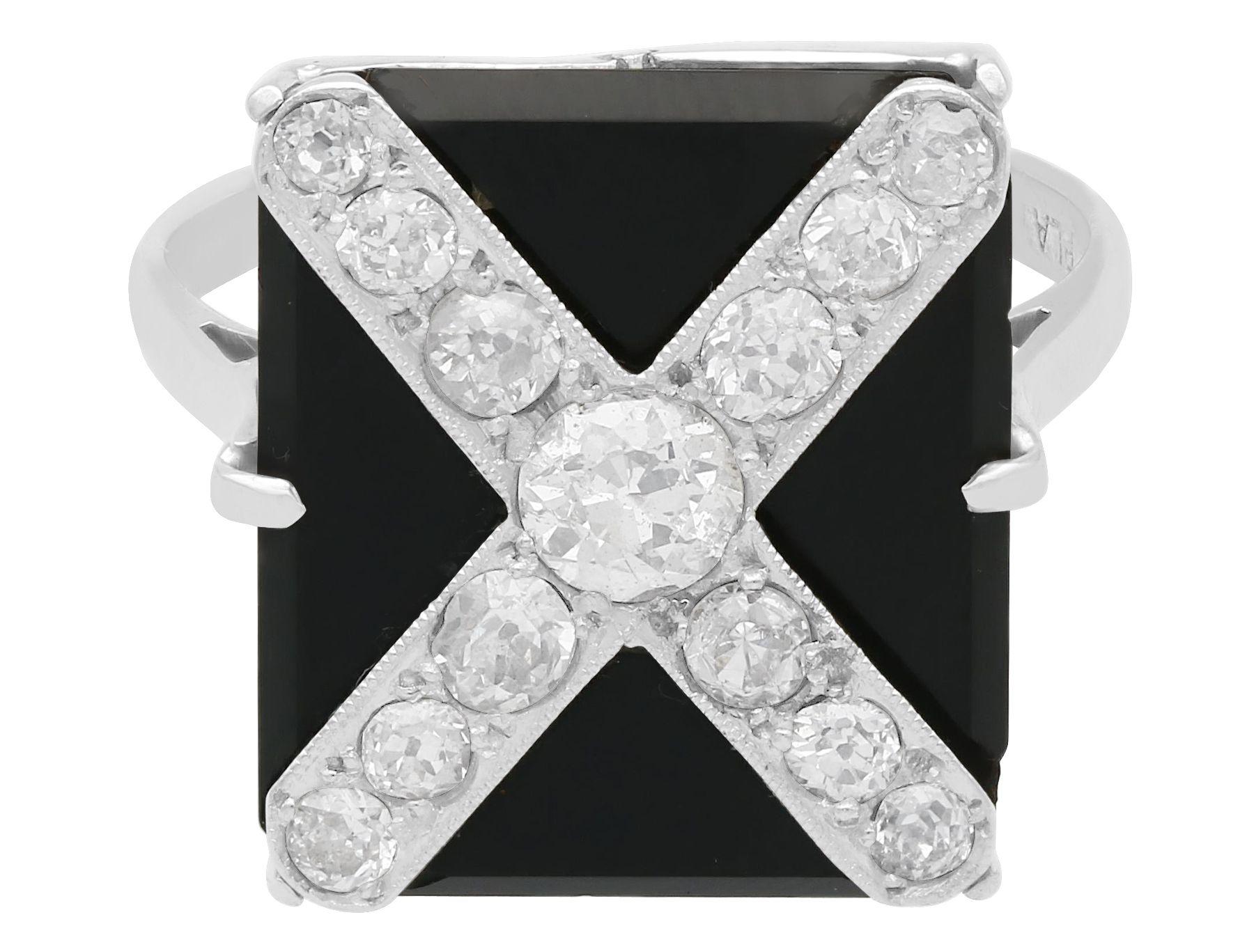 black onyx ring with diamond in the middle