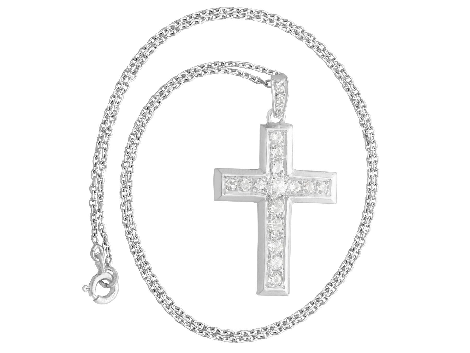 A fine and impressive antique 0.72 carat diamond and 18 karat white gold cross pendant; part of our diverse antique jewelry collections.

This fine and impressive antique pendant has been crafted in 18k white gold.

The stunning cross design is