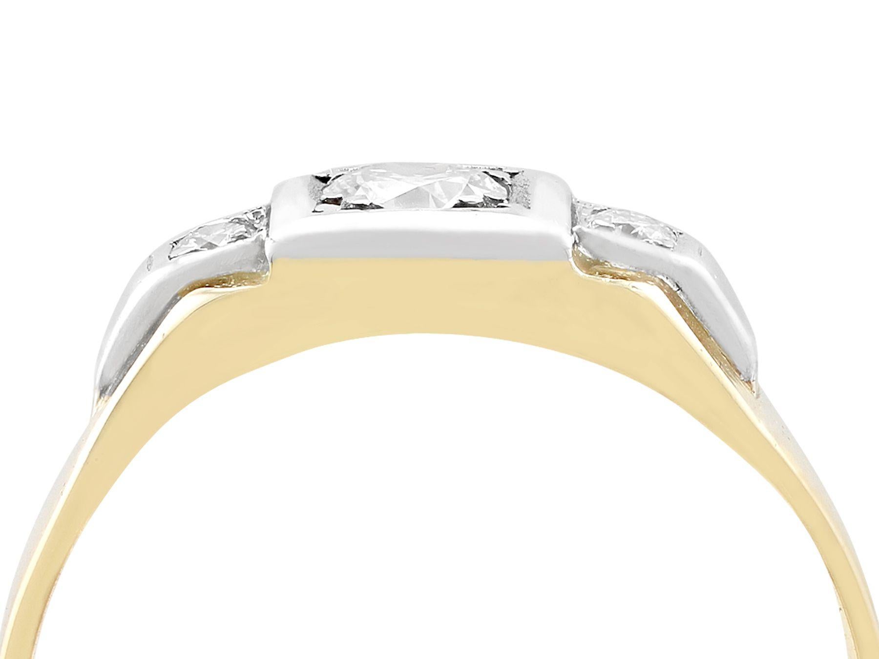 An impressive antique 1930s 0.30 carat diamond and 18 karat yellow gold, platinum set trilogy style dress ring; part of our diverse antique jewelry and estate jewelry collections.

This fine and impressive antique diamond dress ring has been crafted