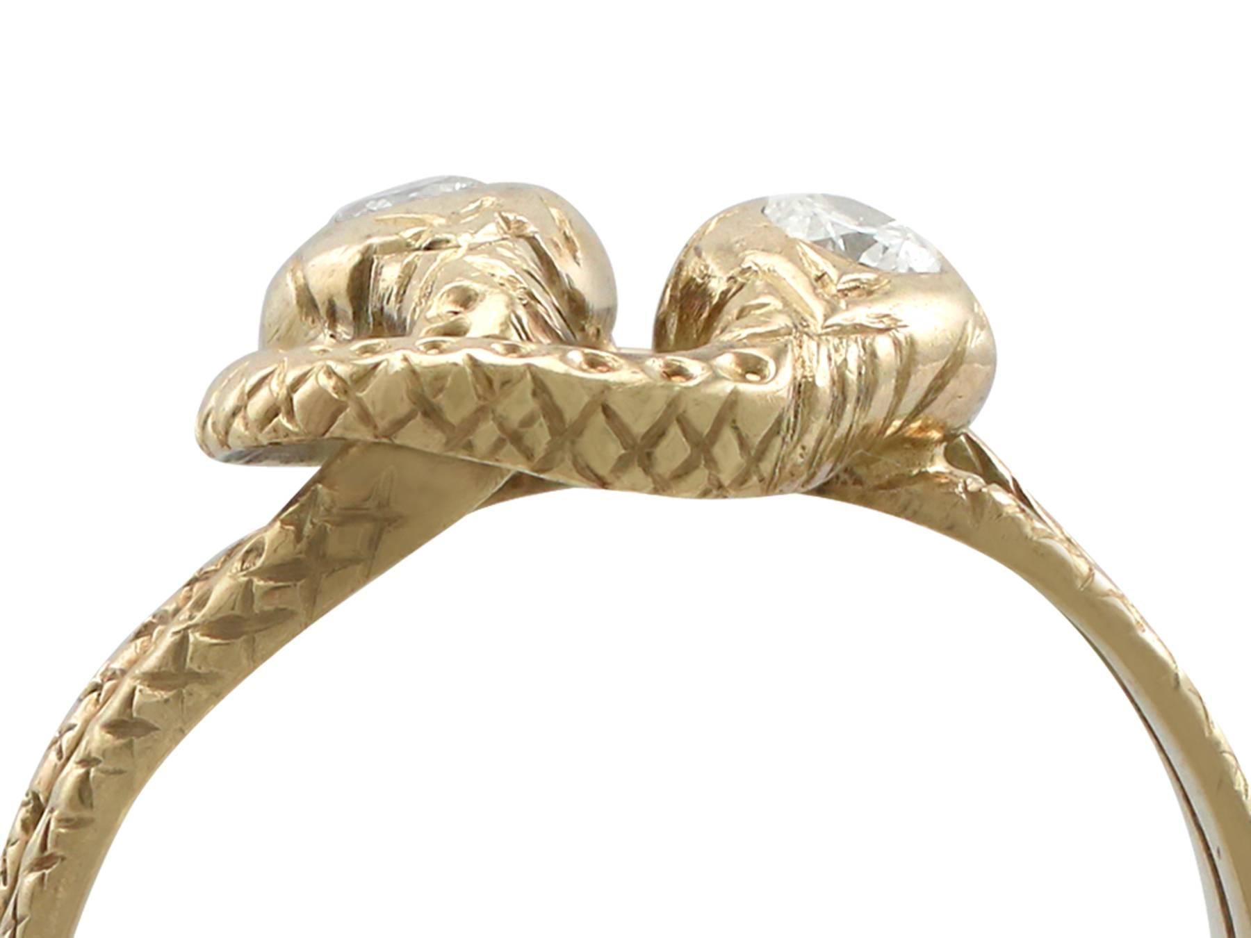 An impressive antique 0.10 Ct diamond and 14k yellow gold double snake ring; part of our diverse antique jewelry and estate jewelry collections.

This fine and impressive antique double snake ring has been crafted in 14k yellow gold.

The ring has