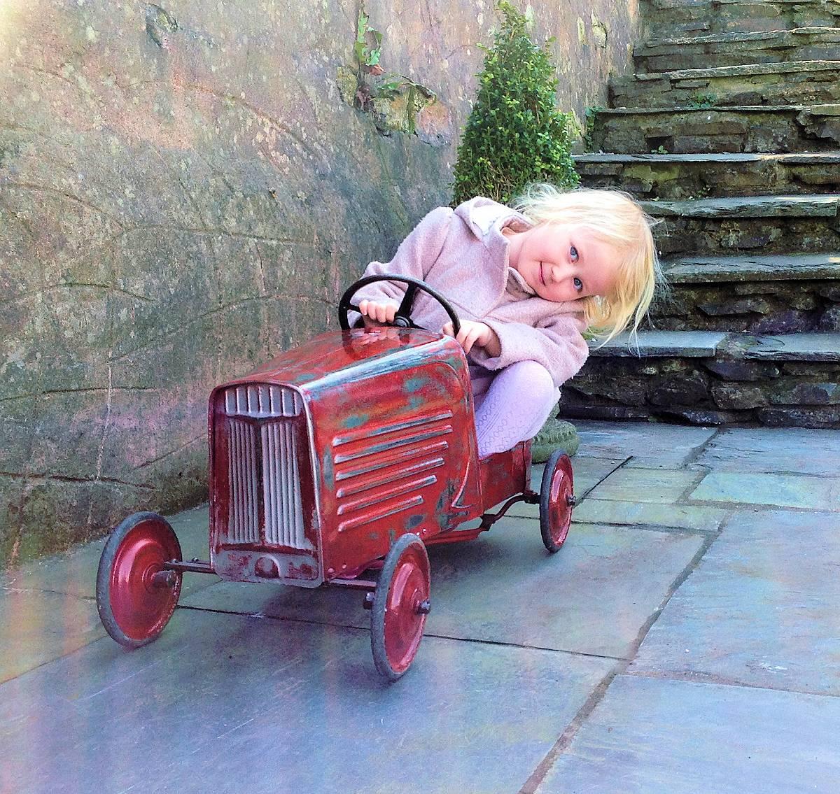 This is a great opportunity to acquire a very rare 1930s. Antique French child's pedal car. Typically French in its styling and one we've not come across before. We've professionally restored the car retaining its original patina. Suitable for