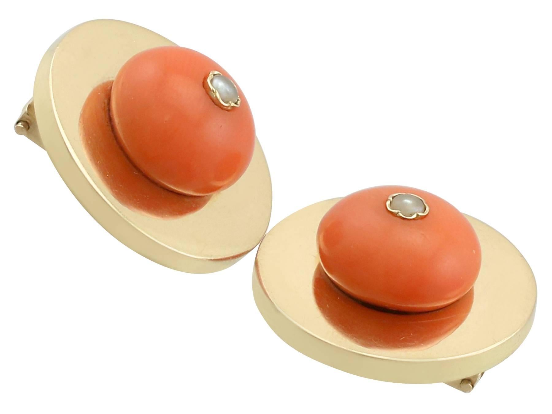An impressive pair of antique European red coral and seed pearl, 18 karat yellow gold clip on earrings; part of our diverse antique jewellery collections.

These fine and impressive coral earrings have been crafted in 18k yellow gold.

The circular,