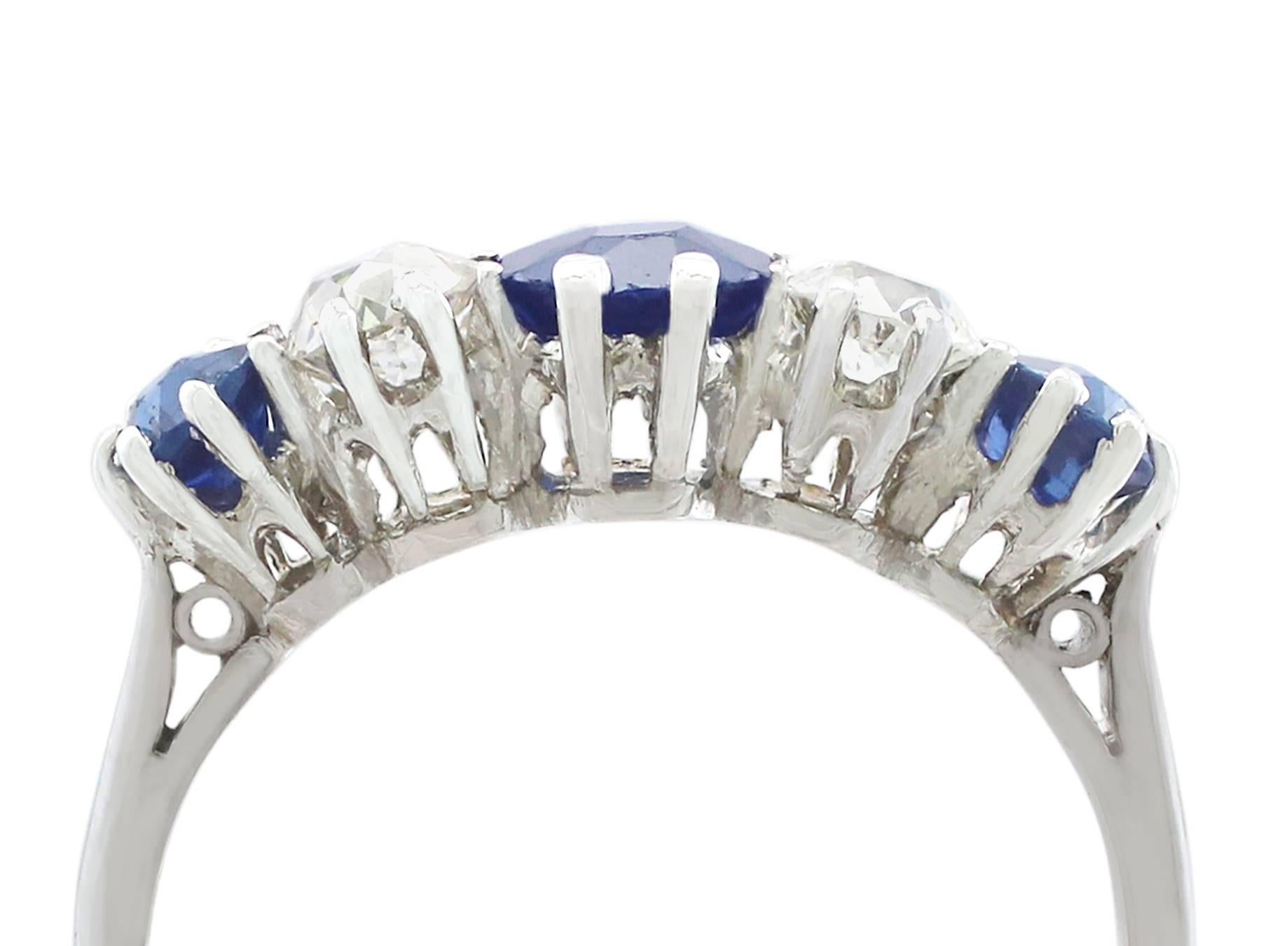 An impressive antique 0.90 carat blue sapphire and 0.55 carat diamond, platinum five stone dress ring; part of our diverse antique jewelry and estate jewelry collections.

This fine and impressive five stone diamond and sapphire ring has been