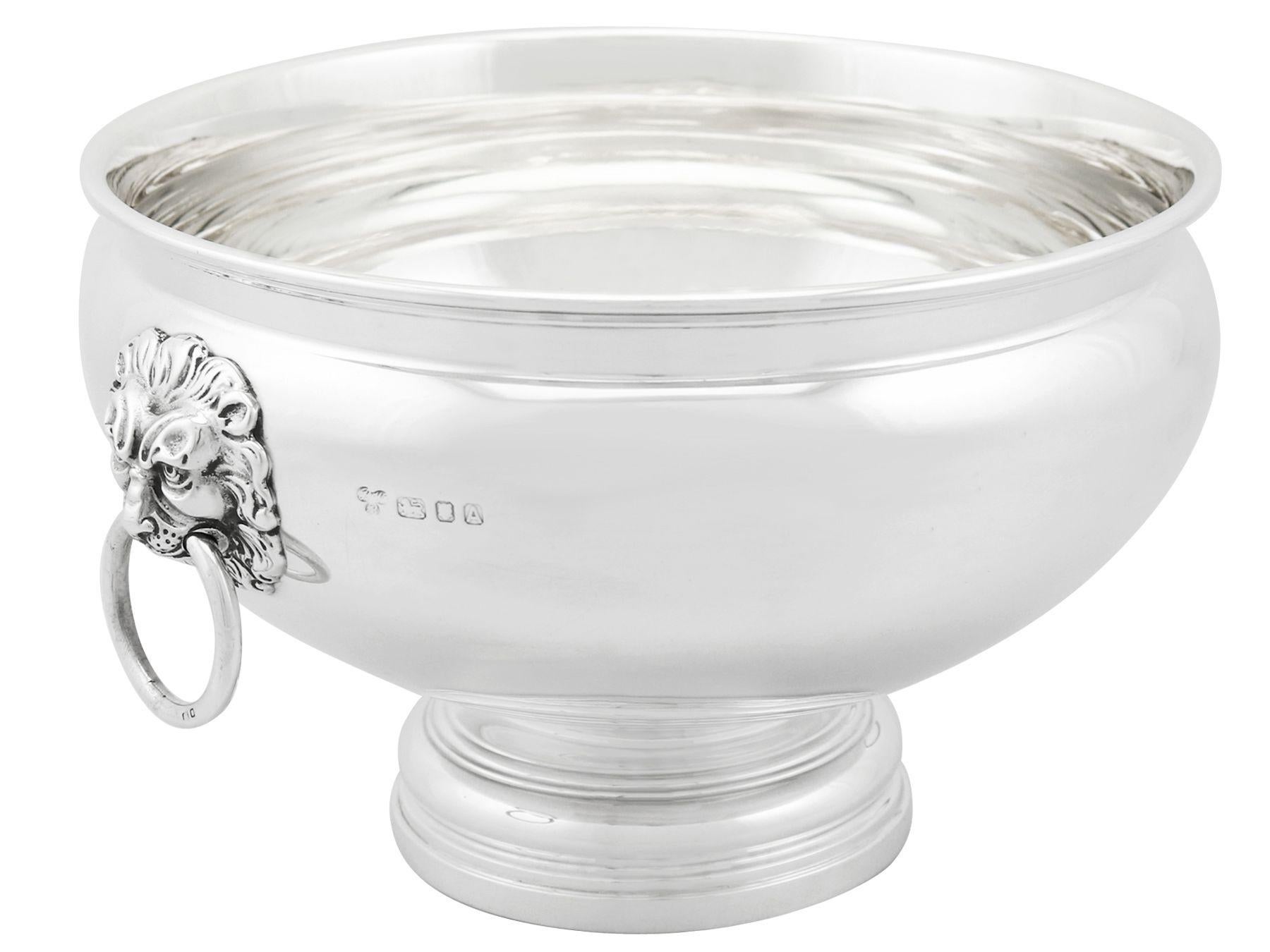 An exceptional, fine and impressive antique Edward VIII English sterling silver presentation bowl; an addition to our range of collectable silverware.

This exceptional antique Edward VIII English sterling silver bowl has a circular rounded form
