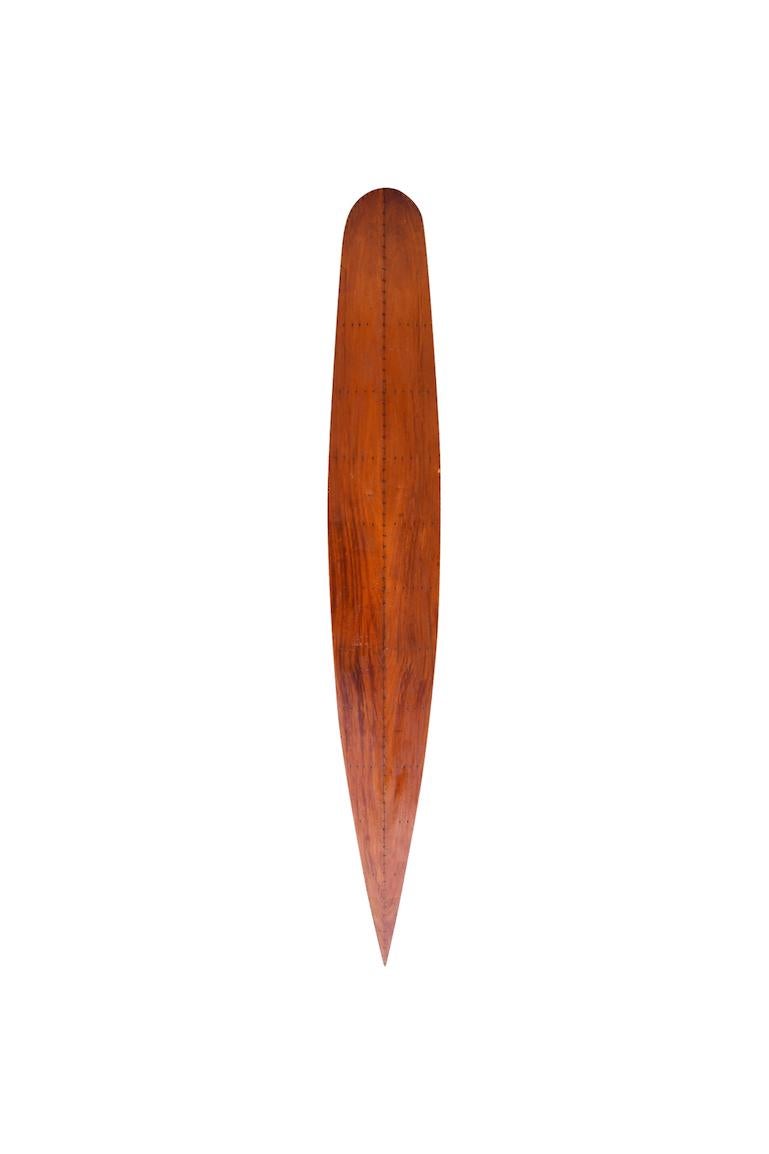 Tom Blake hollow handmade Hawaiian wooden surfboard, circa 1937. A remarkable example of a classic antique surfboard with drain plug and ring tie off. 