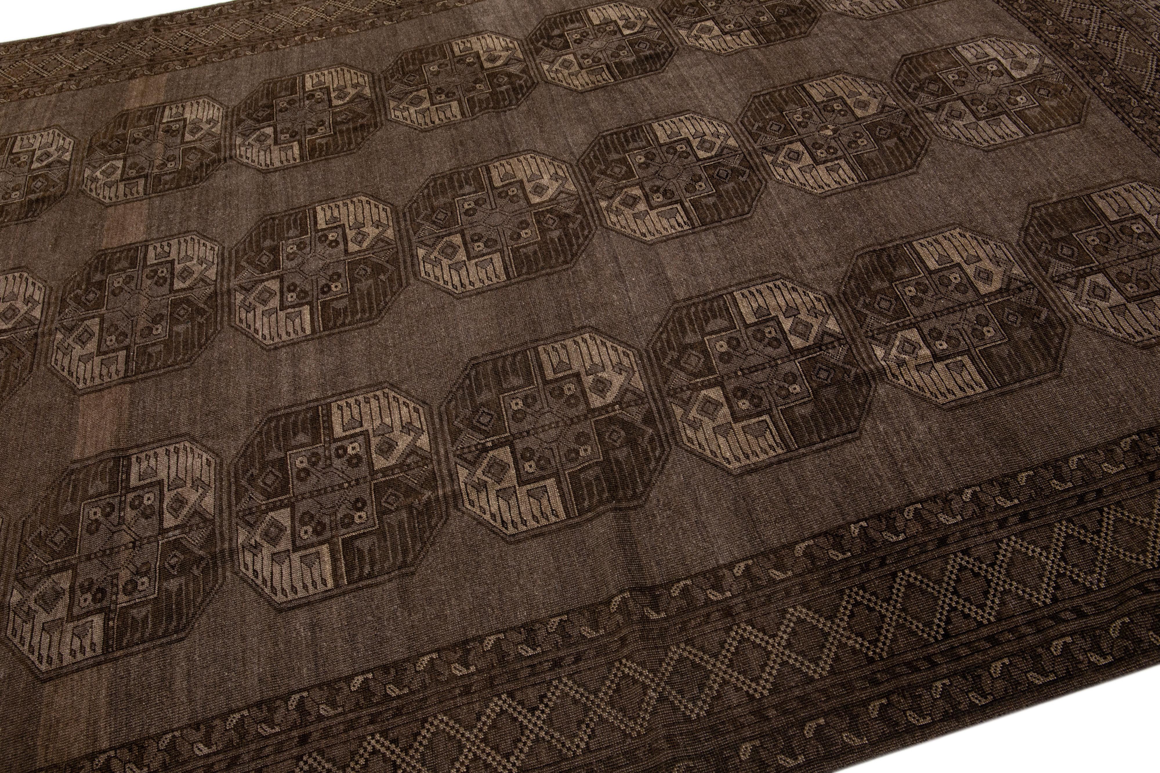 Islamic 1930s Antique Turkmen Handmade Persian Wool Rug with Geometric Pattern in Brown For Sale