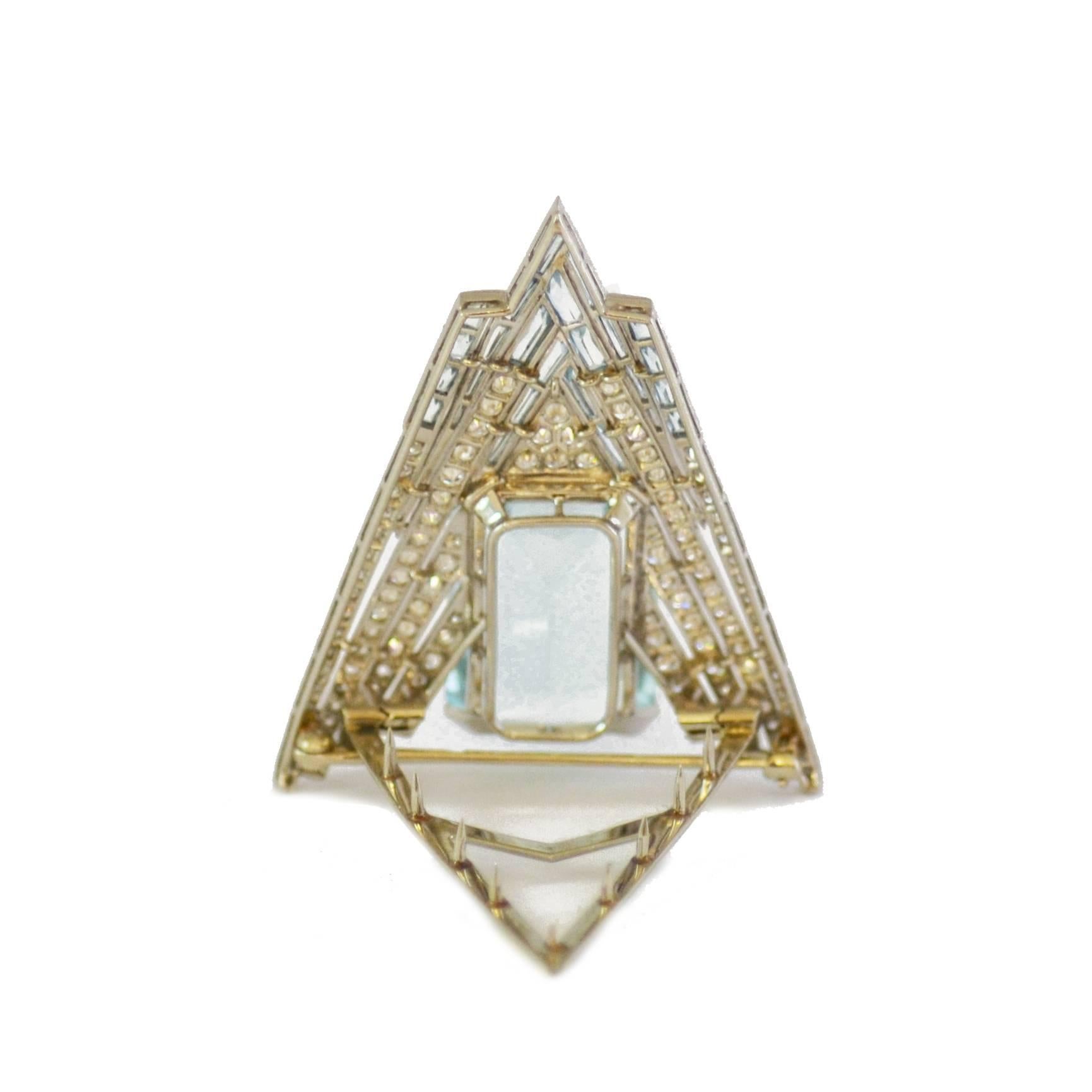 A chevron shaped aquamarine and diamond clip, mounted with a central large aquamarine. Set with brilliant cut diamonds and French cut aquamarines and mounted in platinum. American circa 1930.