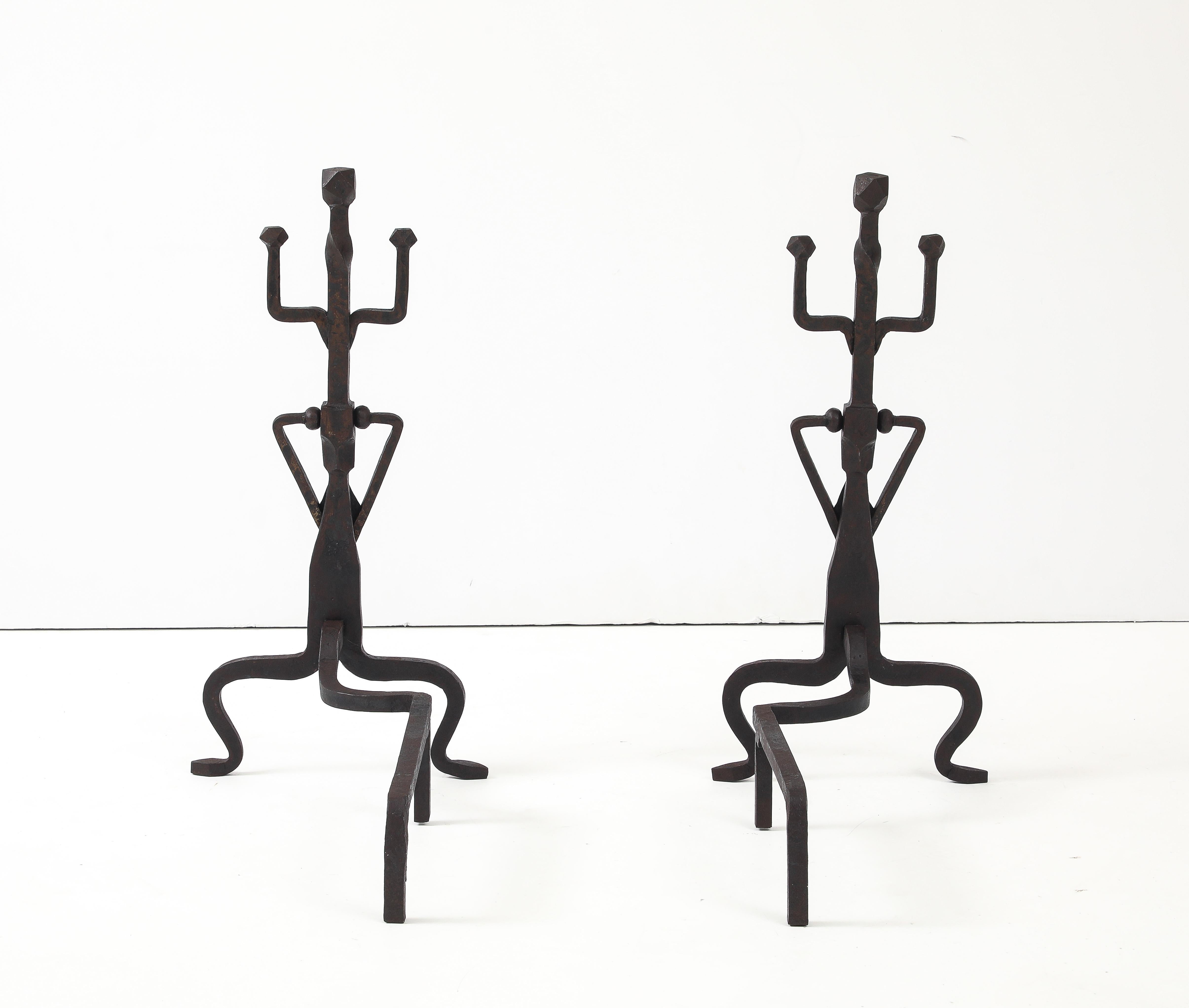 Large pair of 1930's art and crafts abstract andirons, in vintage original condition with some wear and patina due to age and use.