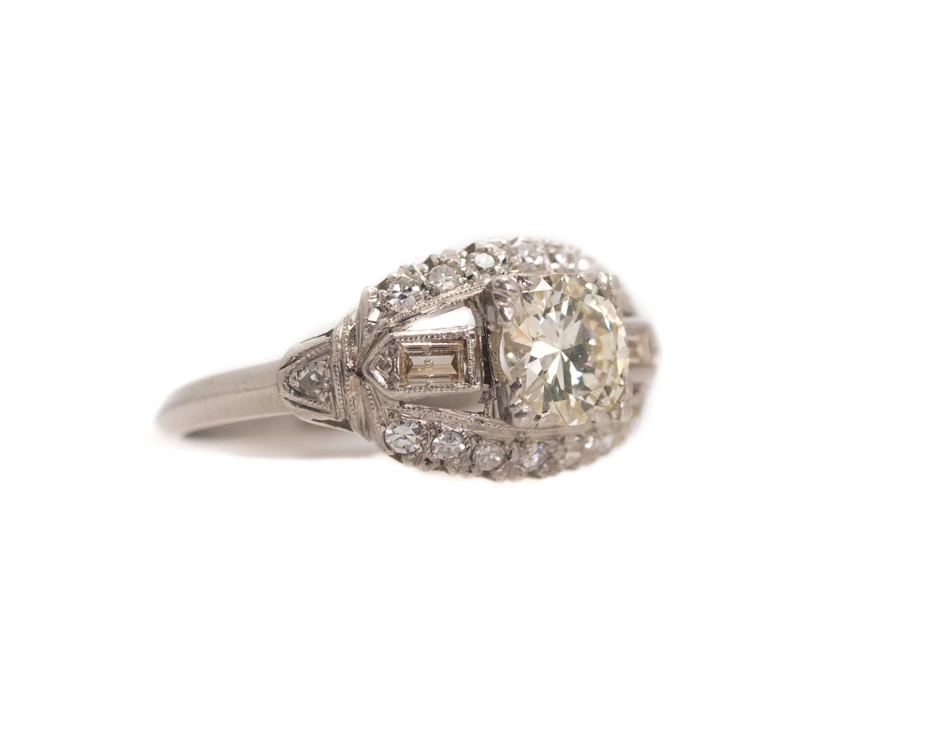 1.0 Carat Total Weight Diamond Engagement Ring - Platinum, Diamonds

Features a 0.80 Old European Diamond Center Stone. The round center stone is flanked by Baguette Diamonds. Round Brilliant Diamonds are set along the upper and lower edges of the