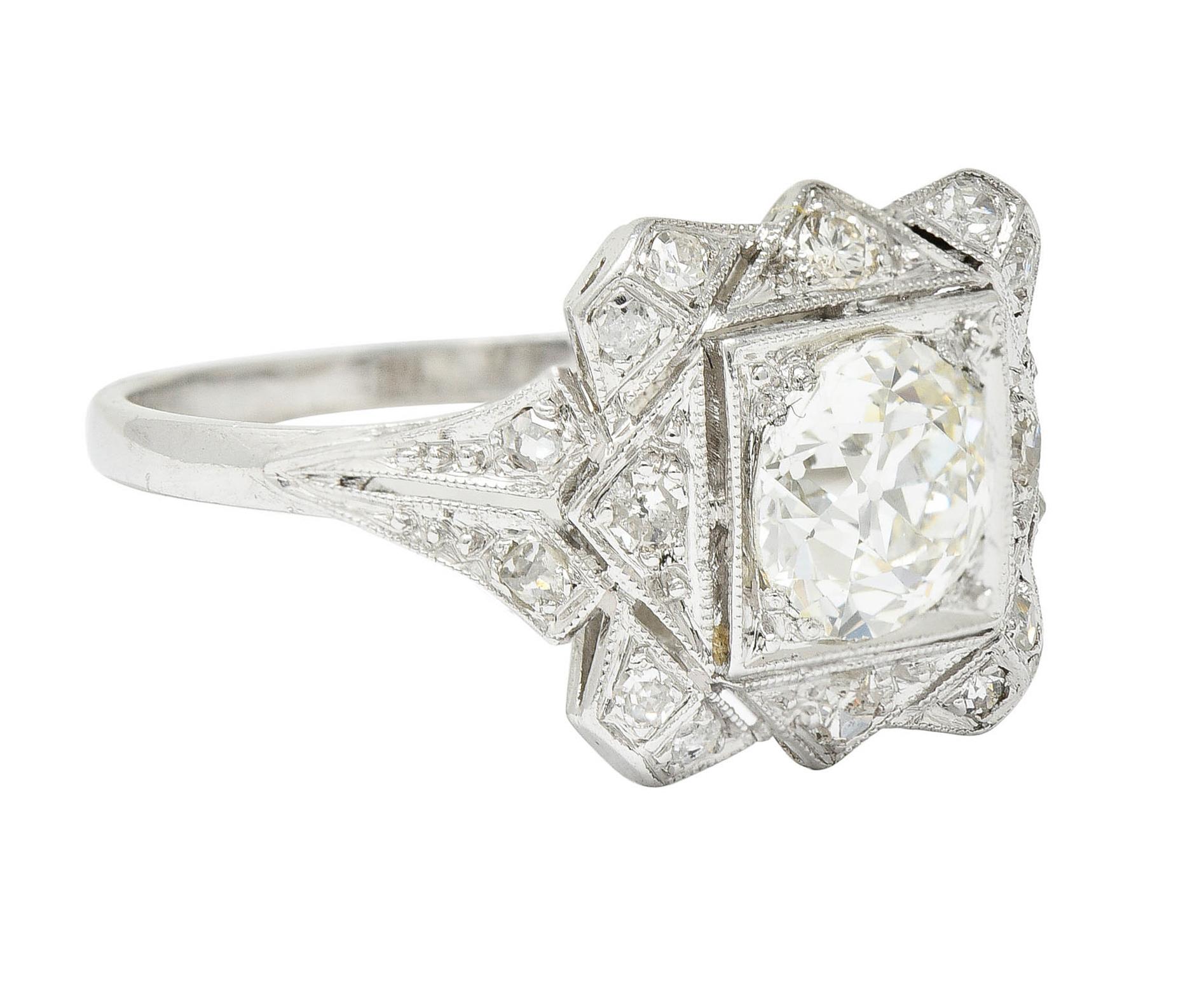 Centering an old European cut diamond weighing 1.02 carat - J color with VS1 clarity

Set low in a square form head and surrounded by a geometric halo

Accented by rose and single cut diamonds weighing in total approximately 0.38 carat - J/K color
