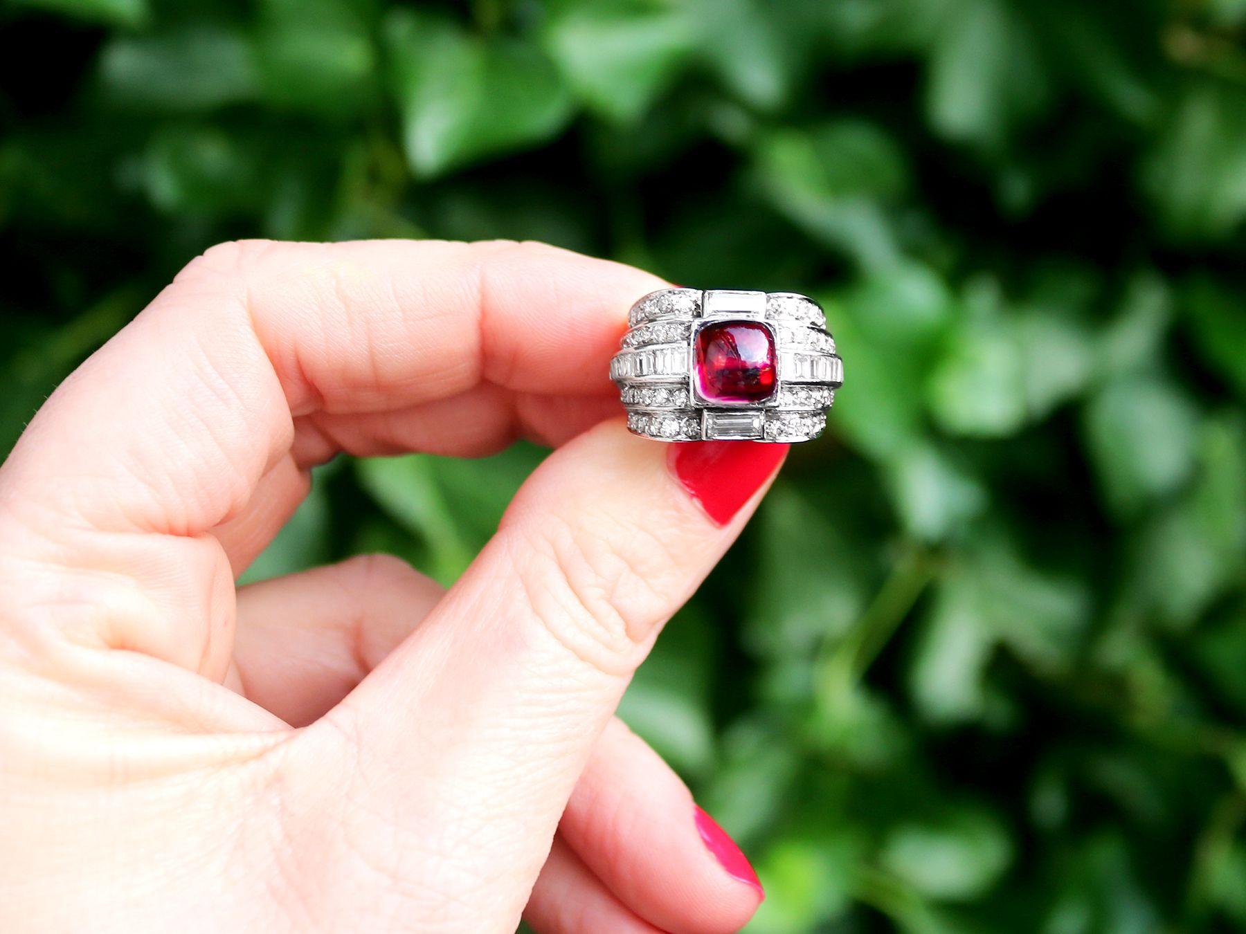 A stunning antique 1930s Art Deco 2.21 carat pink tourmaline and 1.82 carat diamond, platinum cocktail ring; part of our diverse antique jewelry collections.

This stunning, fine and impressive cabochon cut pink tourmaline ring with diamonds has