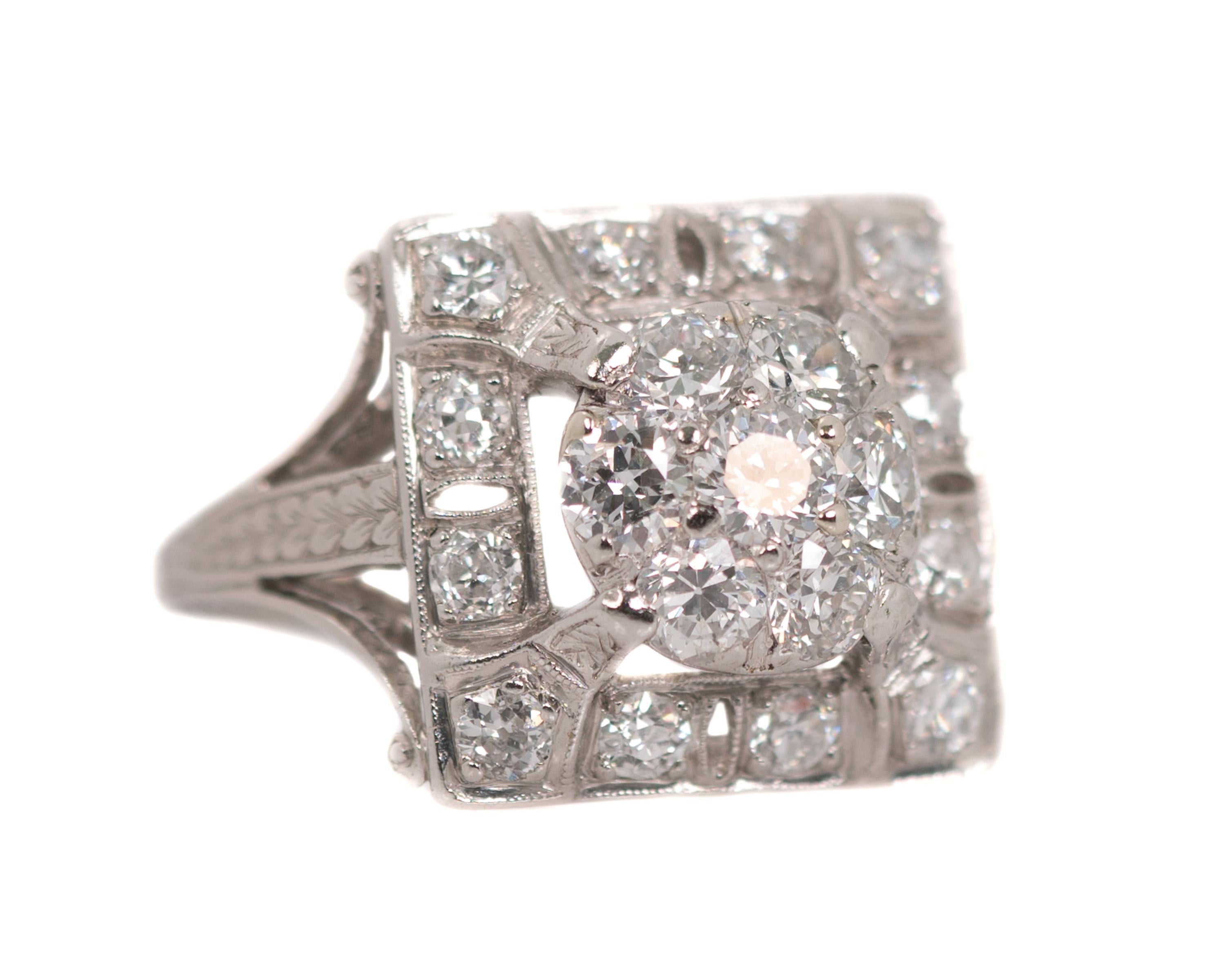 1930s Art Deco TK Co Square Diamond Cluster Ring - Platinum, Diamonds

Features:
2.5 carat total weight Old Miner and Old European Diamonds (19 Diamonds)
Square Frame
Round Center
Split Shank 
Ornate Open Shoulders and Gallery
Ribbon Scroll Upper