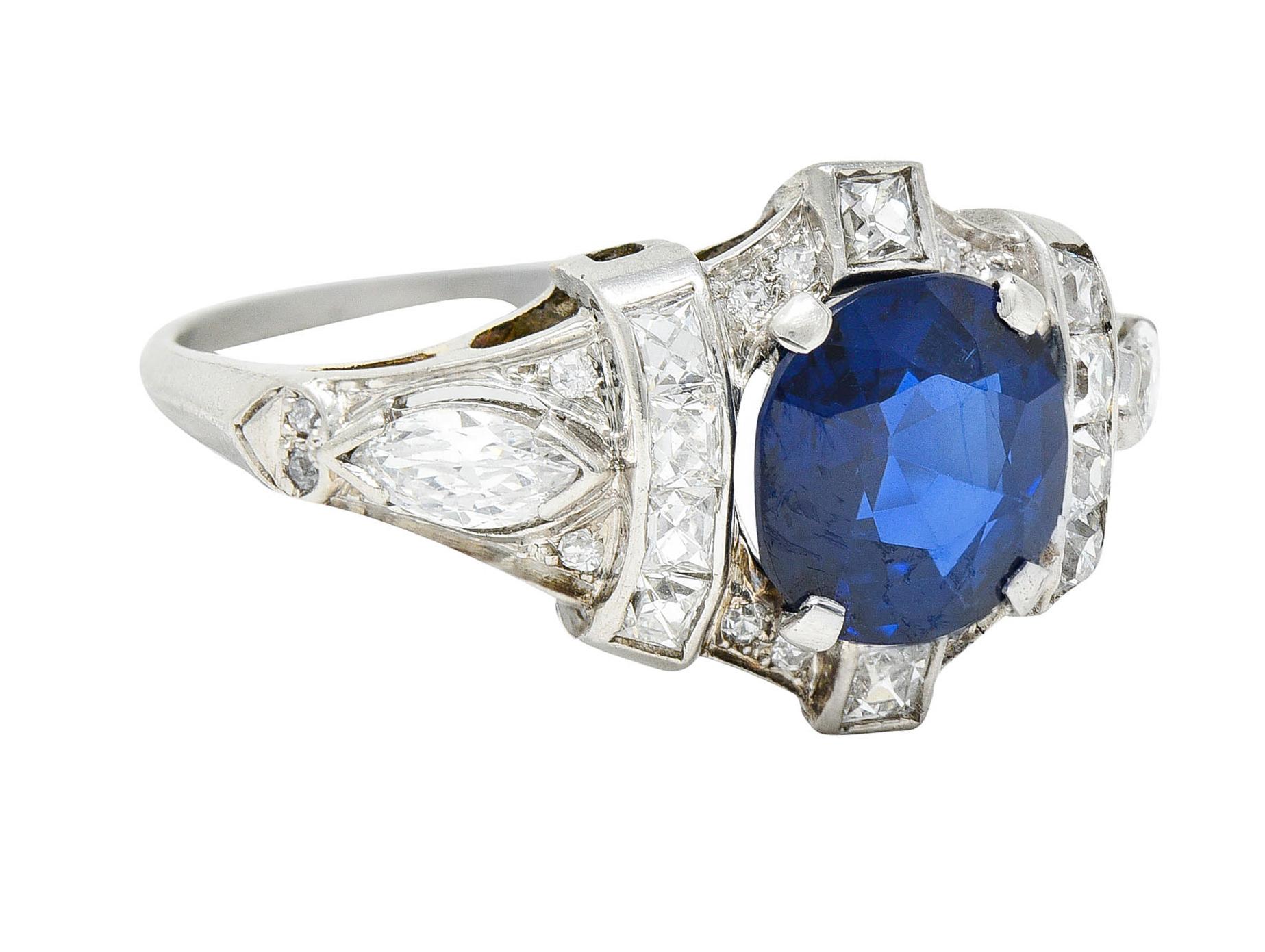 Band ring features a cushion cut sapphire weighing approximately 1.90 carat

Transparent with incredible saturated blue color

With channel set French cut diamonds and marquise cut diamonds at shoulders

Accented throughout by old single cut