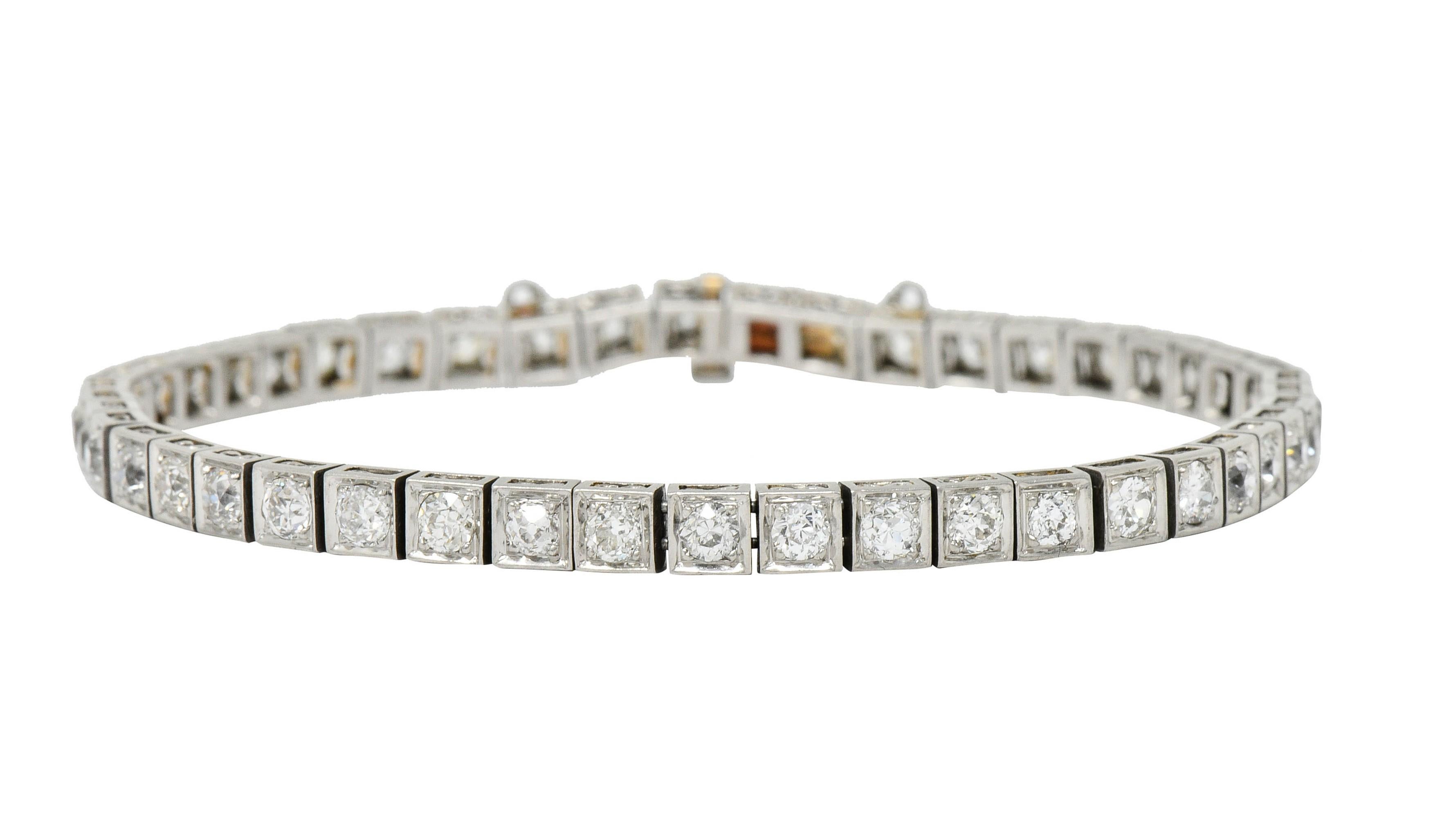 Line style bracelet is comprised of articulated square form links

Featuring old European cut diamonds weighing approximately 4.85 carats total; H to J color with SI and I clarity

Decorated throughout with pierced infinity motif

Completed by a