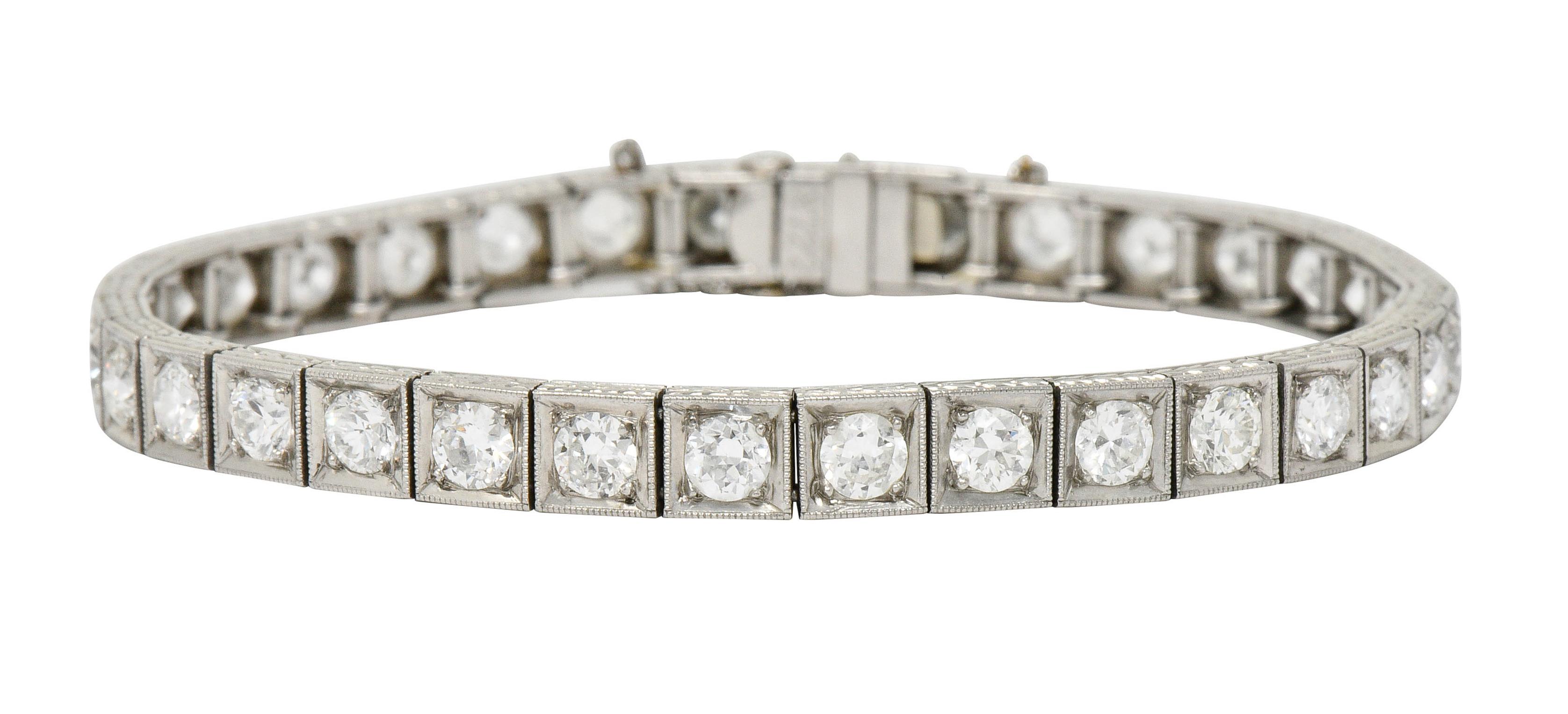 Line bracelet is comprised of square form links with a delicate milgrain edge

Set with transitional cut diamonds weighing in total approximately 5.90 carats; H to J color with VS clarity

Profile edge is deeply engraved with a stylized wheat