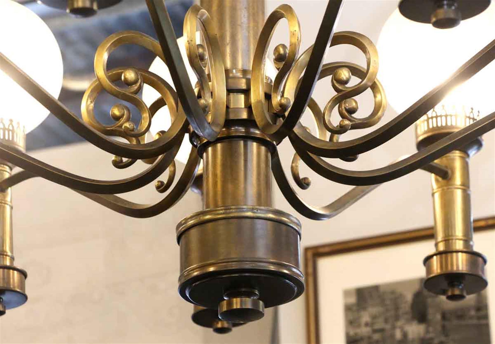 Mid-20th Century 1930s Art Deco 9 Globe Brass Chandelier with Round Textured Globes