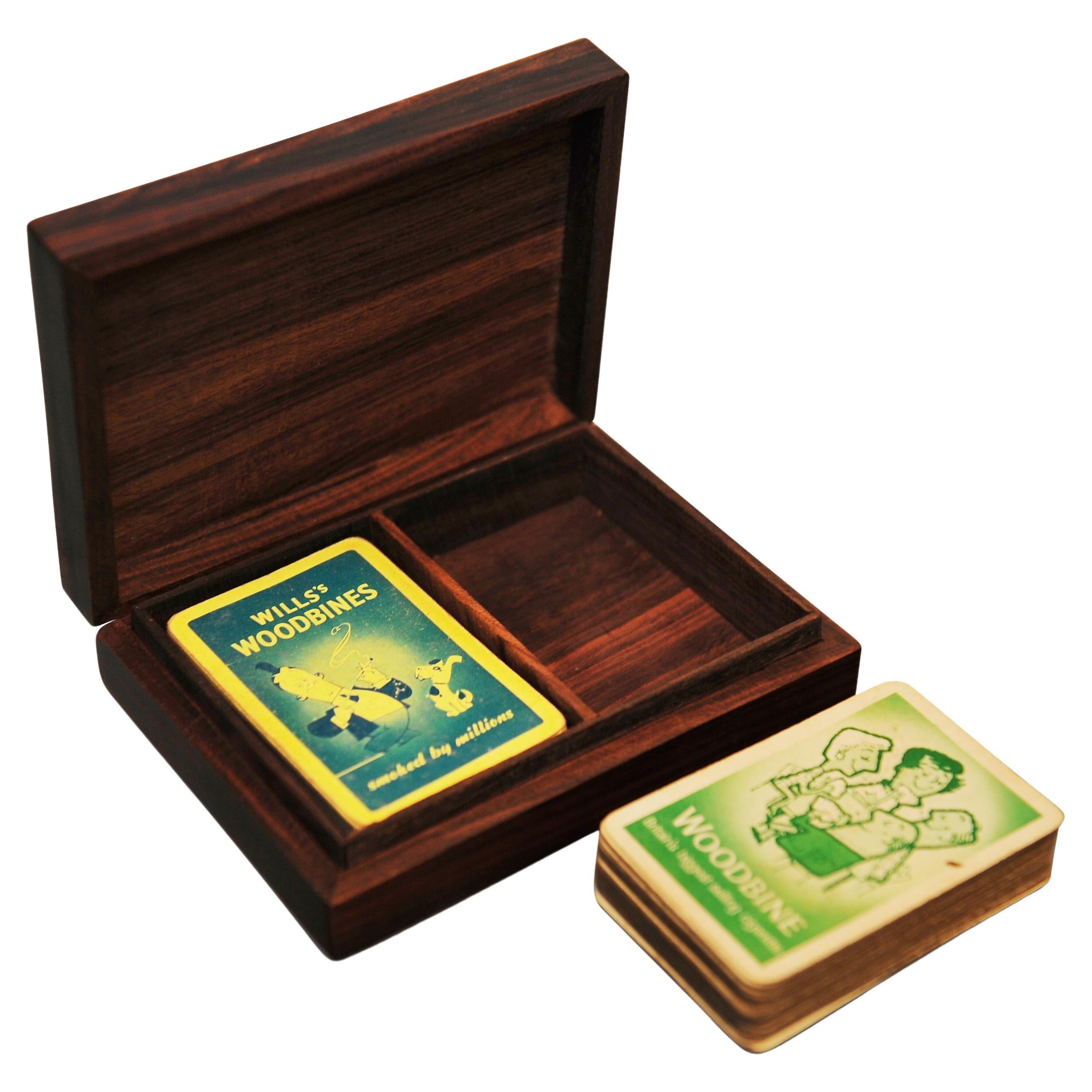 1930's Art Deco Ace of Spades Boxed Set Complete With Will's Woodbine's Cards.

Great gift for the avid card player, or games fan.
Dimensions are guesstimates. 

Woodbine was launched in 1888 by W.D. & H.O. Wills. Noted for its strong unfiltered
