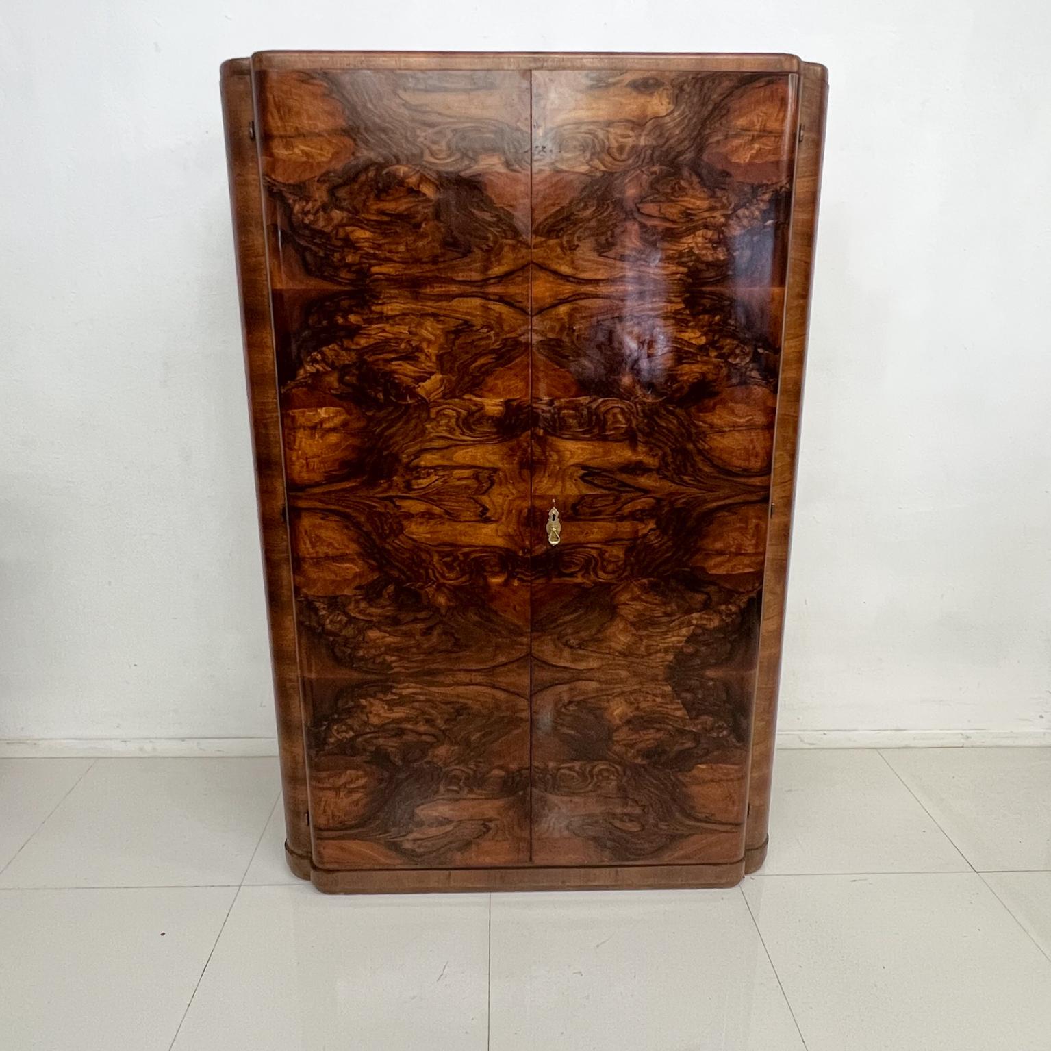 1930s ART DECO European elegance armoire in lacquered burlwood fine wardrobe dresser cabinet, Italy
71 tall x 47 wide x 24.5 deep and interior: 21 deep x 65 tall x 45.5
Preowned original unrestored vintage condition.
Review our images