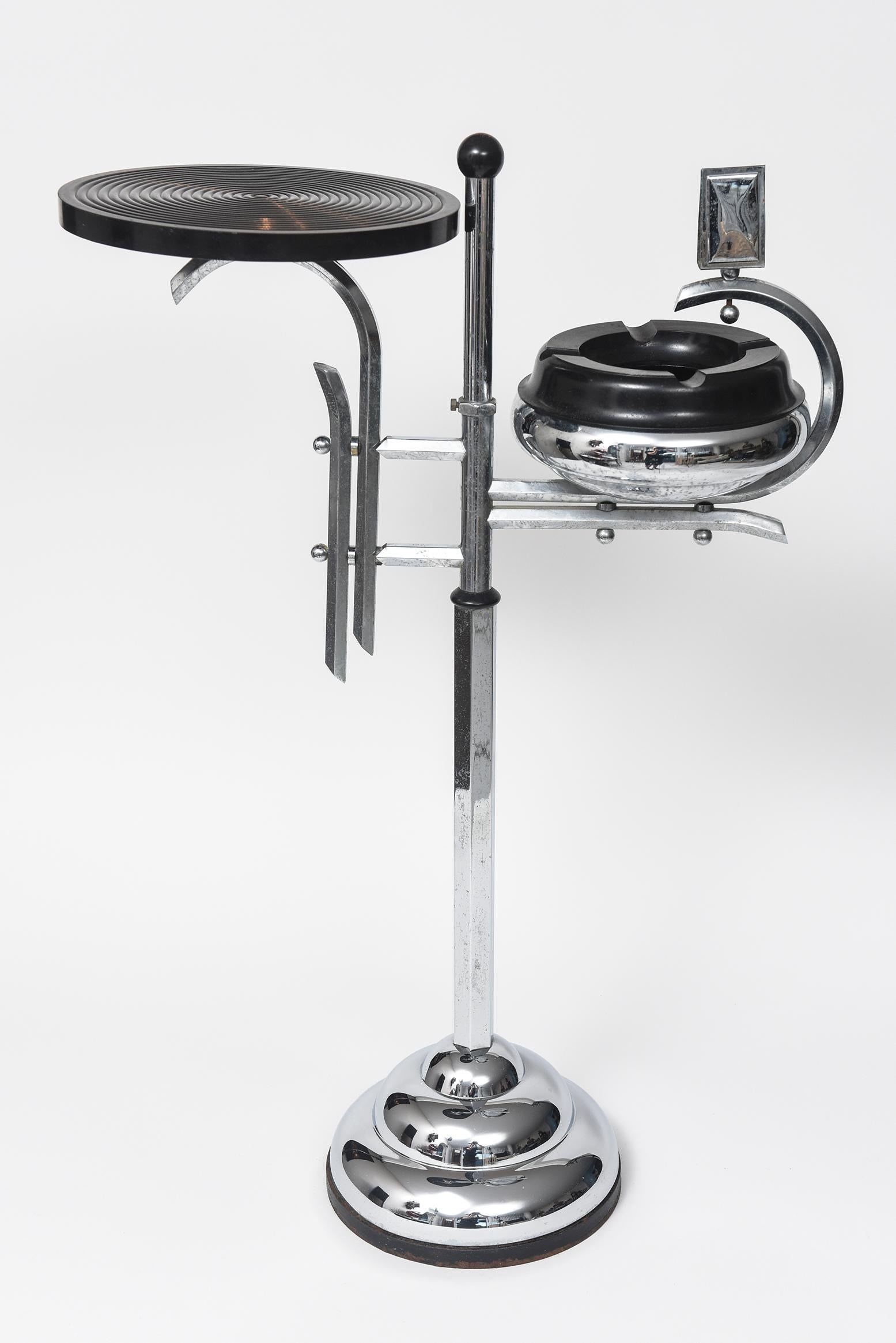 Stunning streamline machine age Art Deco Ashtray stand smoking table. Perfect for holding a snack or drink as well as your cigarette or cigar. The previous owner used it in their bathroom to hold a candle and matches. It is make of chrome and