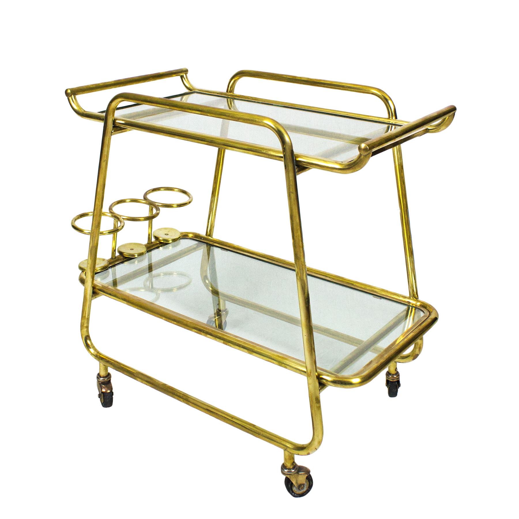 Art Deco bar cart, polished brass and glass, three bottles rack at the bottom. Originals wheels. Excellent condition and quality.

Italy, circa 1930.