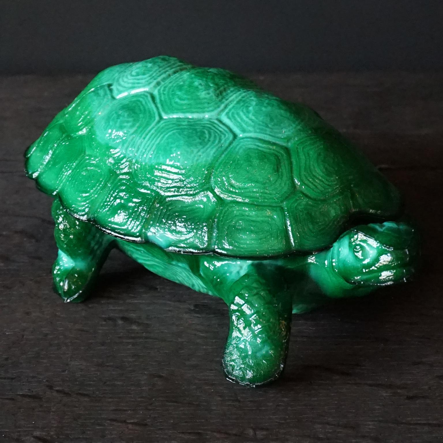 A lovely 1930s Art Deco Czech Republic made malachite glass turtle trinket dish, by Curt Schlevogt designed by Mario Petrucci

Malachite glass is intended to look like malachite (a green copper carbonate mineral), or more generally, to look like