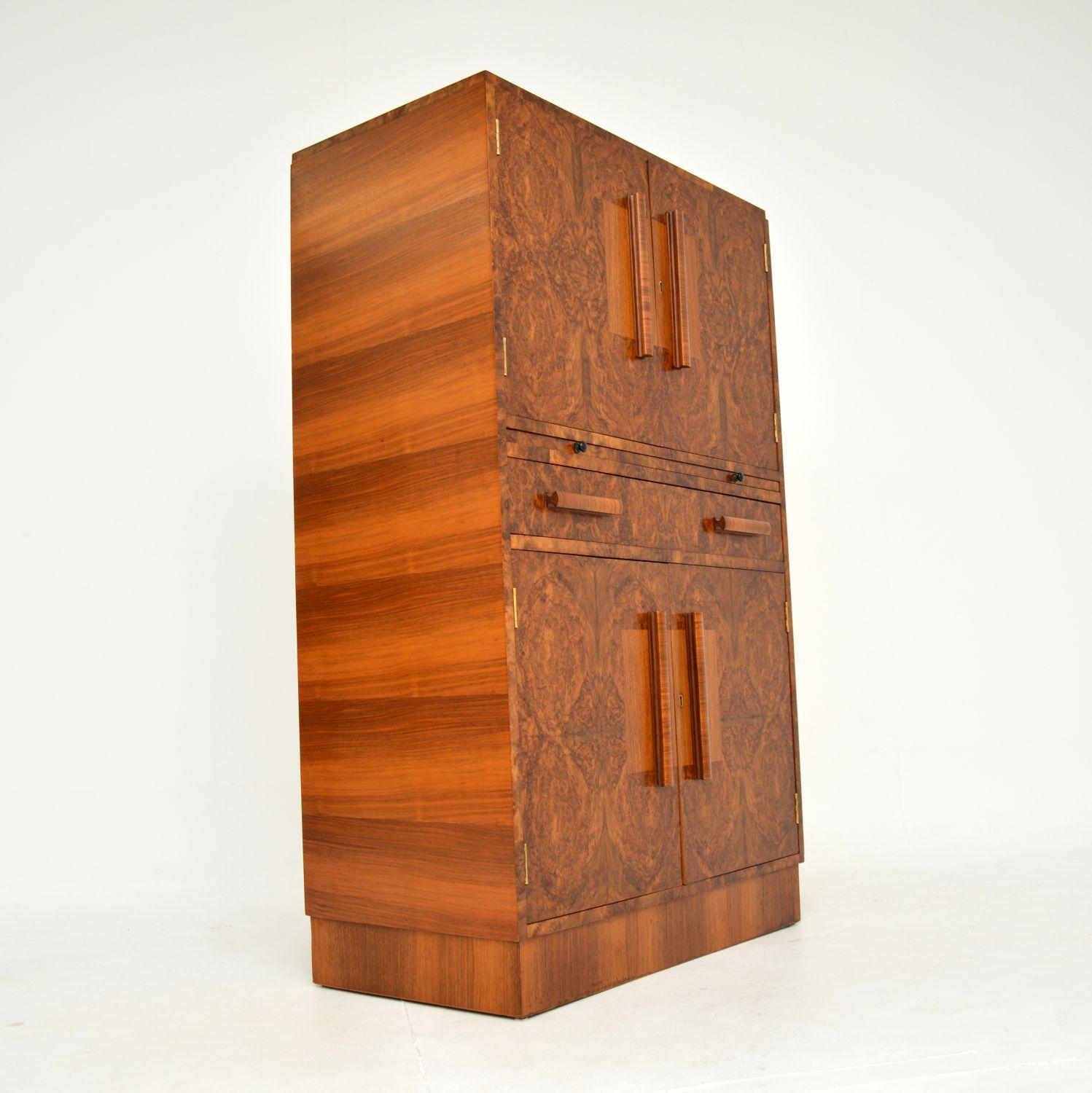 An absolutely stunning original Art Deco period cocktail drinks cabinet in burr walnut. This was made in England, it dates from the 1930’s.

The quality is outstanding, this is extremely well made. It has a stylish and compact design, with some