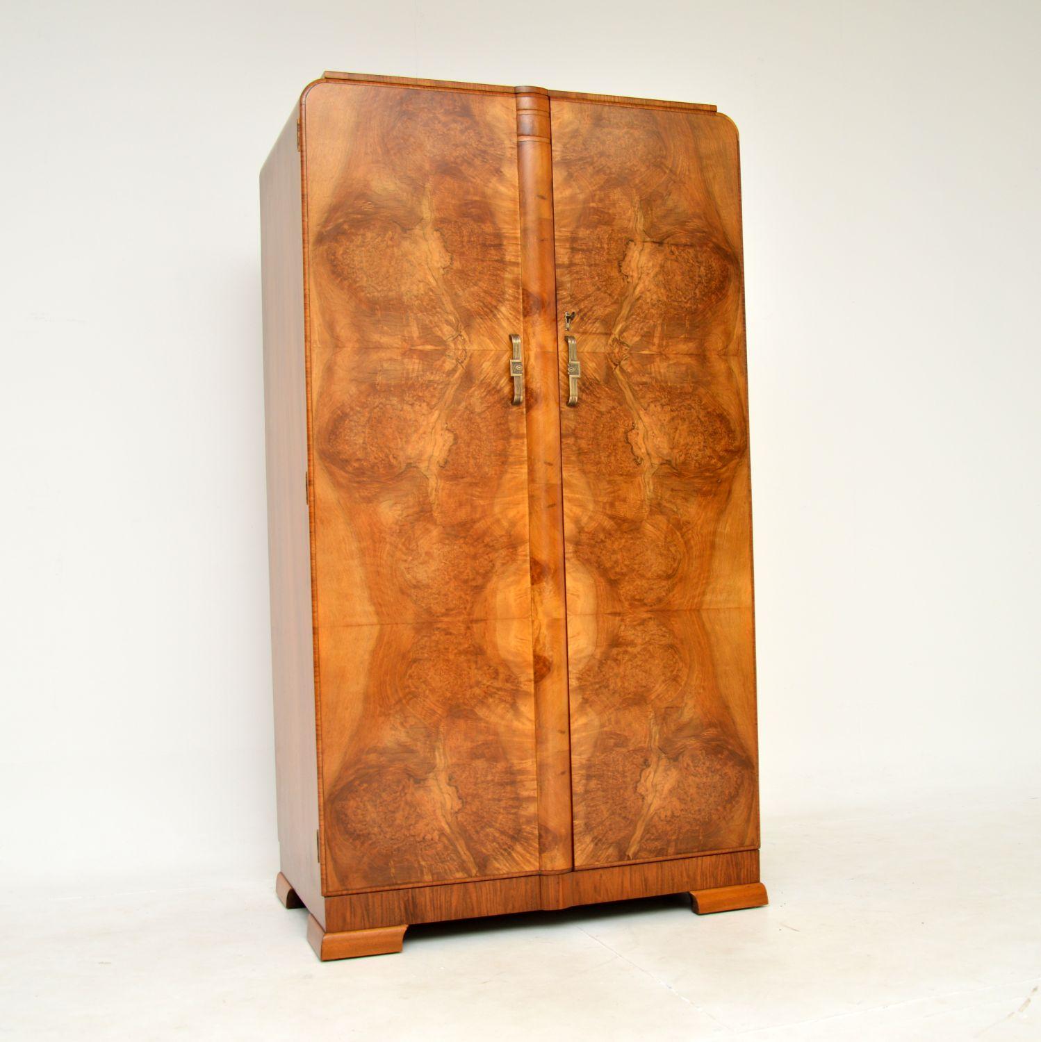 A stunning original Art Deco period compactum wardrobe in walnut. This was made in England, it dates from the 1930’s.

The quality is superb, this has a gorgeous design and is a very useful size. There are amazing burr walnut grain patterns, this