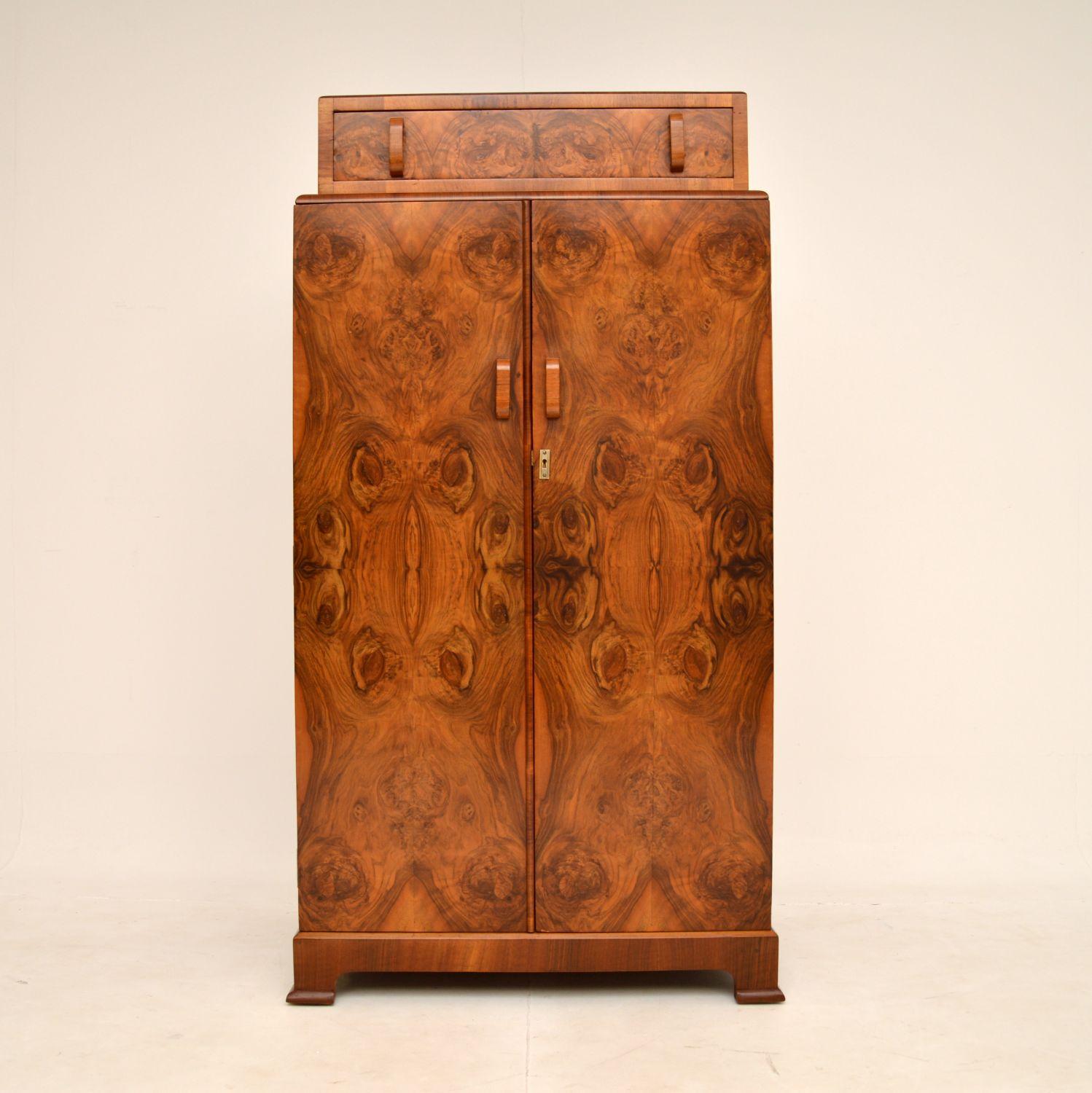 A beautiful original Art Deco period walnut compactum wardrobe. This was made in England, it dates from the 1930’s.

It is of superb quality, it’s really well made and is a very useful size. The large lower two door compartment contains shelving,