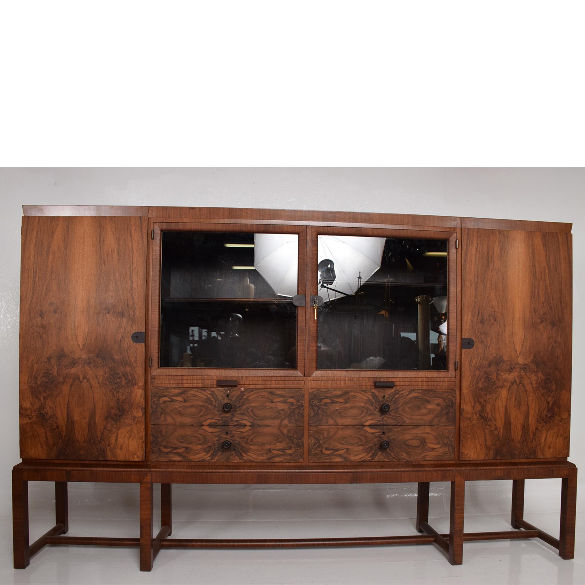 Exquisite Wall CABINET designed by Bruno Paul for Deutsche Werkstätten Hellerau GmbH Germany 1930s. Iconic Bauhaus. 
Beautiful craftsmanship utilizing exotic woods; four sections with storage, adjustable shelves, pull-out drawers and service