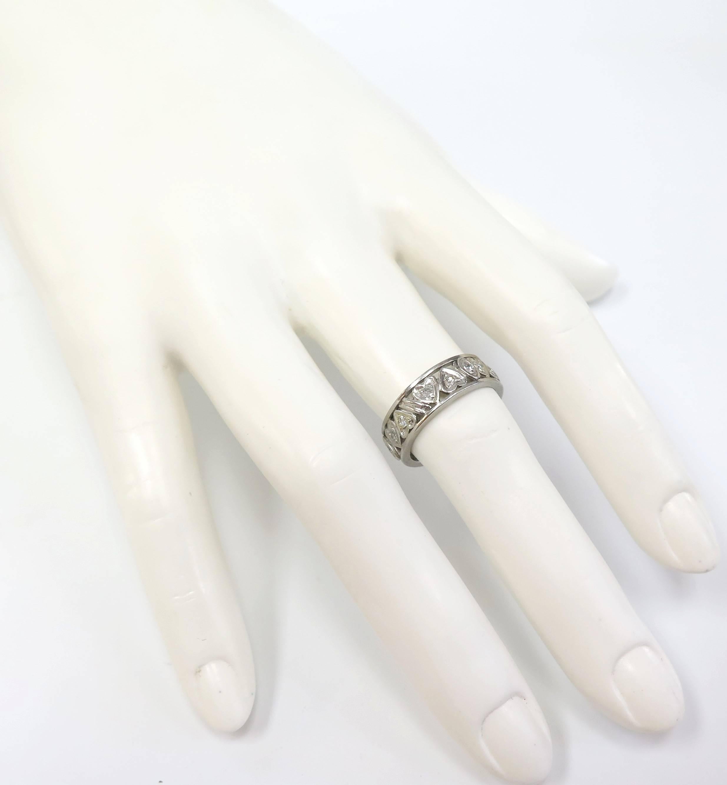 This romantic Art Deco Eternity Band features diamonds in heart-shaped frames. Radiant with 1/2 ct. t.w. of glittery single cut diamonds set in Platinum, this wedding band brings your forever promise to life.

size 6 1/2