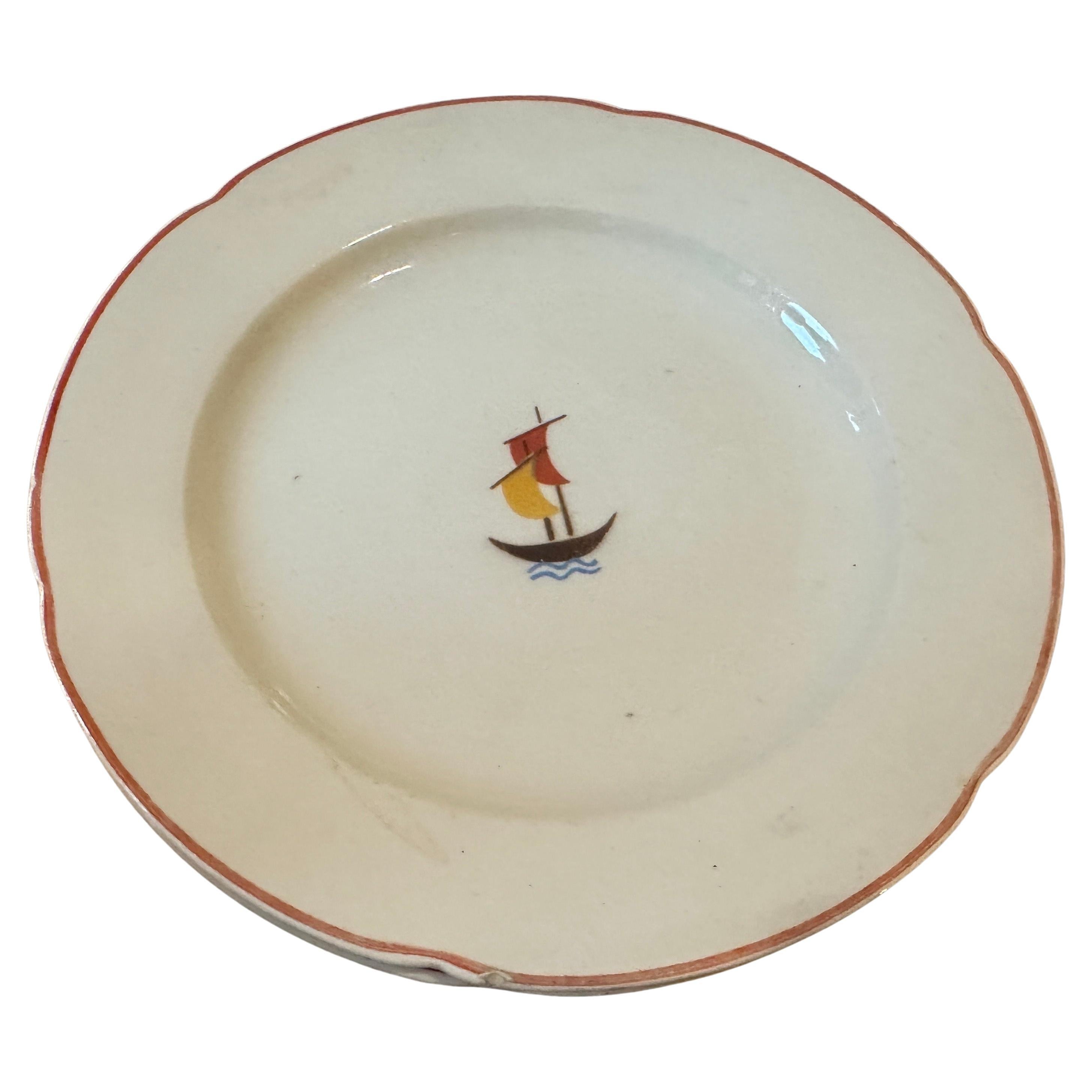 An art deco cake service designed by Gio Ponti in the Thirties and manufactured in Italy by S. C. Richard. The service is composed by 8 pieces, 1 cake plate, 6 small plates diameter cm 20 and on small oval plate.  The decor representing a sail boat