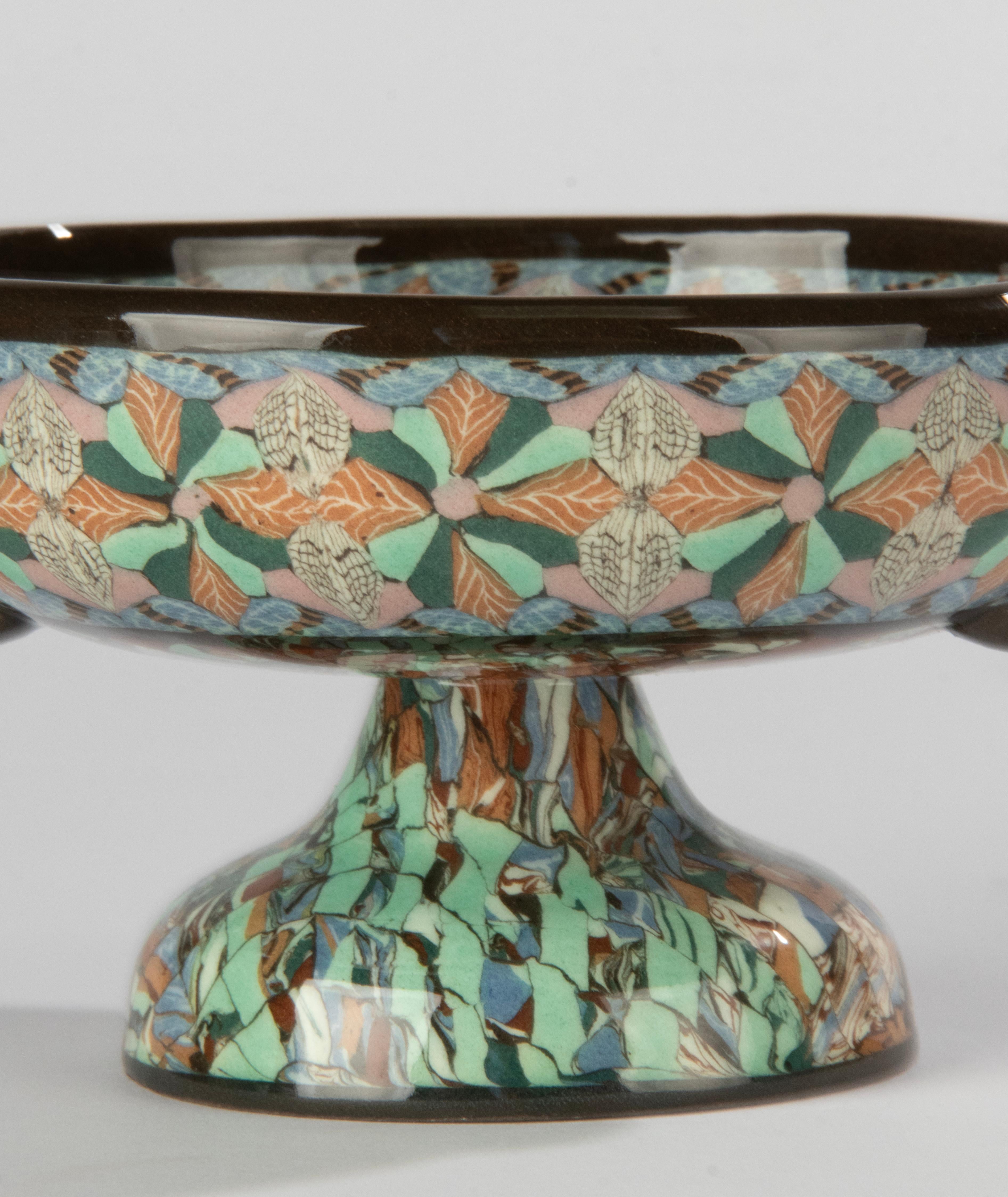 A beautiful ceramic coupe, designed by Jean Gerbino for Vallauris. Nice design and colors in the characteristic style of Jean Gerbino. The bowl is marked on the bottom.
It is in very good condition. No chips and no hairlines. Beautiful glossy glaze