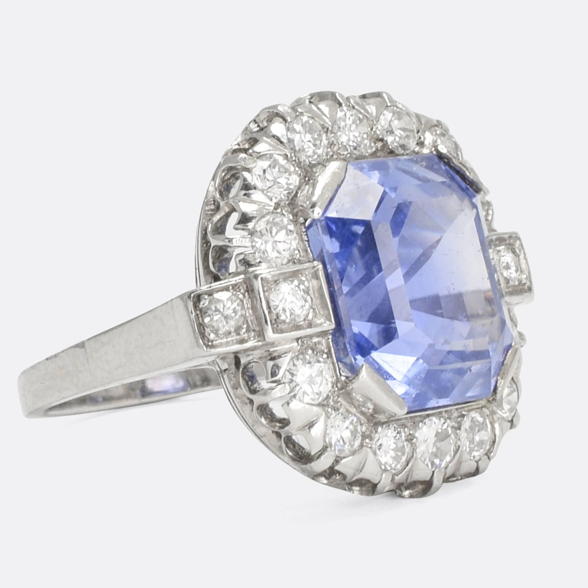 An extraordinary French Art Deco masterpiece, this 1930s cluster ring is absolutely stunning. The principal stone is a 7.79 carat natural Ceylon Sapphire (no heat), with exceptional colour and a perfect cut. It's surrounded by a cluster of brilliant