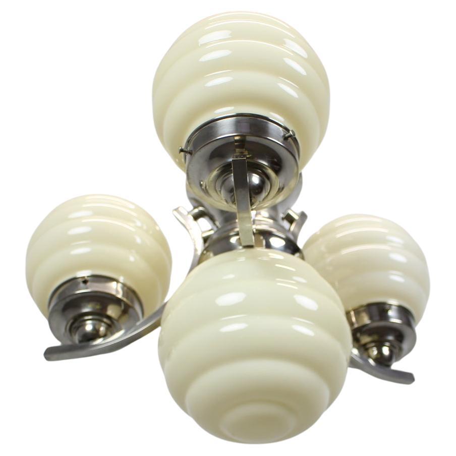 1930s Art Deco Chrome Chandelier with Champagne Ribbed Glass Globes For Sale