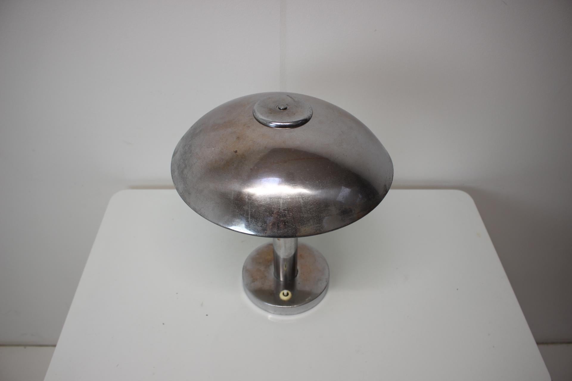 Chrome mushroom table lamp, made in Czechoslovakia, in the 1930's.
Made of chrome.
Repolished, cleaned, shows signs of use (patina, some scratches.
Fully functional.