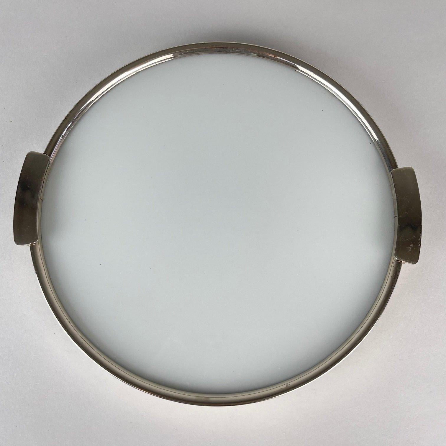 Beautiful Art Deco round tray made of chromed metal and milk glass.
