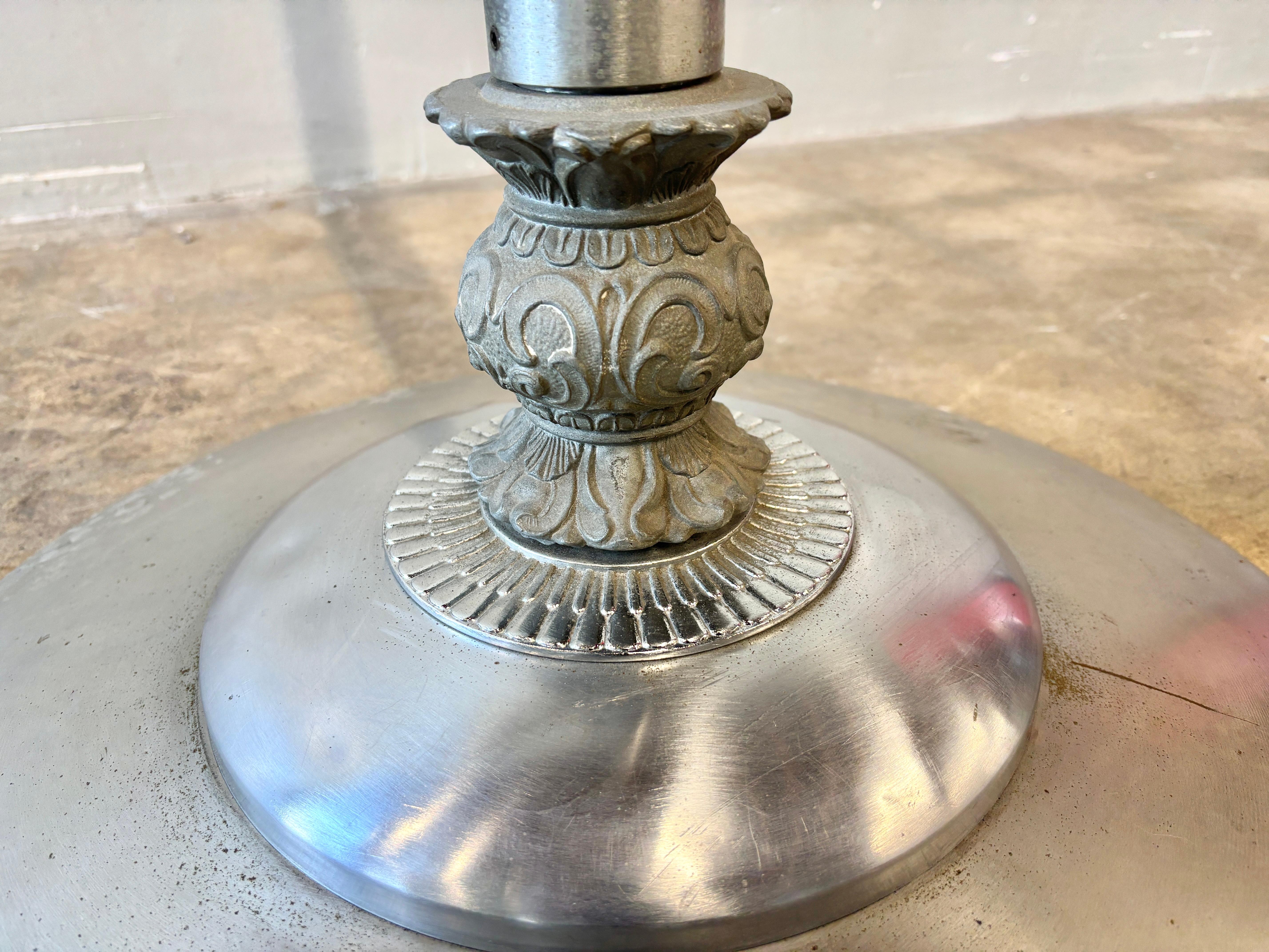 Rare Art Deco clothing rack.  Formerly used in a vintage clothing store in West Hollywood, CA.  Chrome plated steel with cast iron detail element on bottom.  Chrome is lightly pitted and worn consistent with age.  Very sturdy.  

28