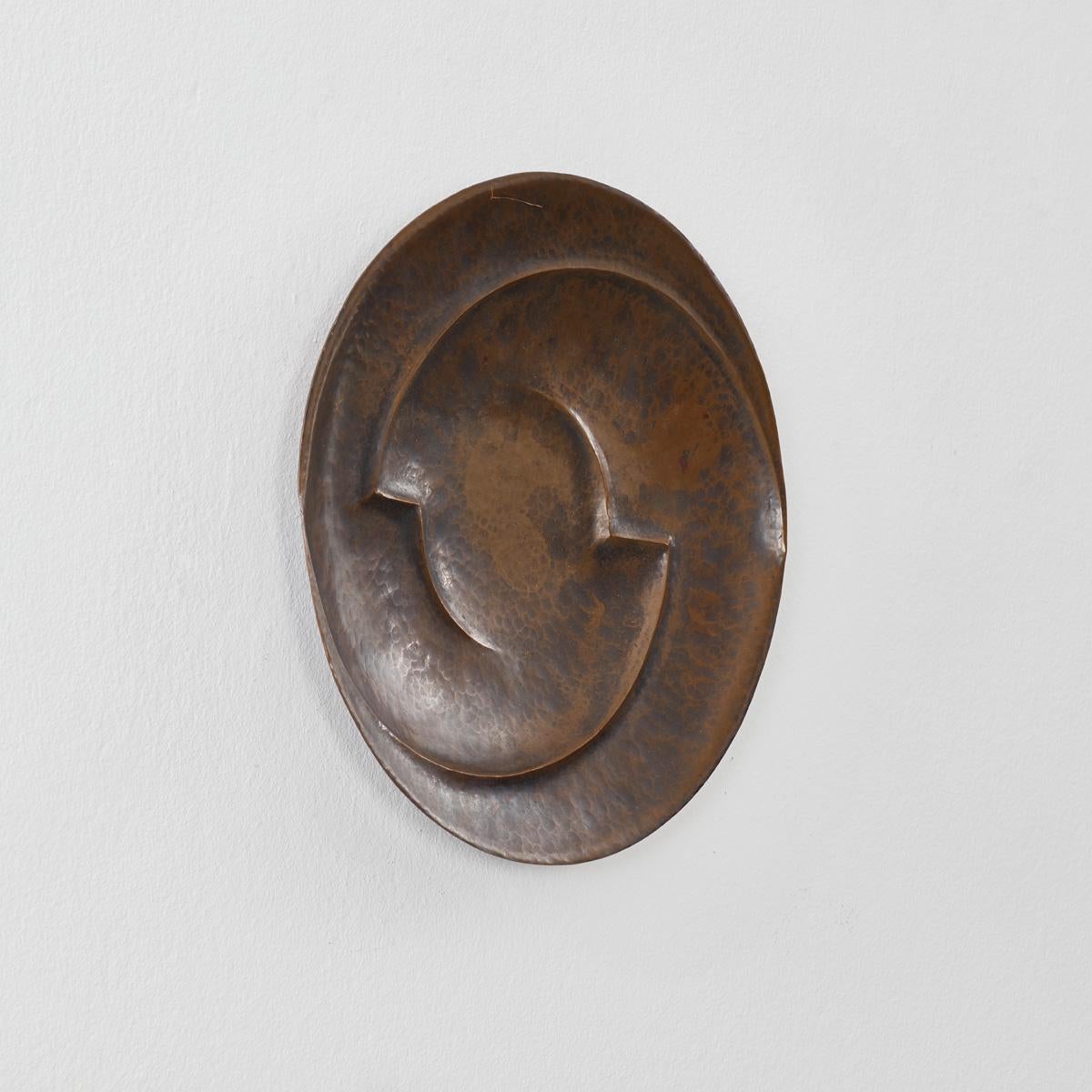An Art Deco hammered copper plate from an unknown Dutch art school.