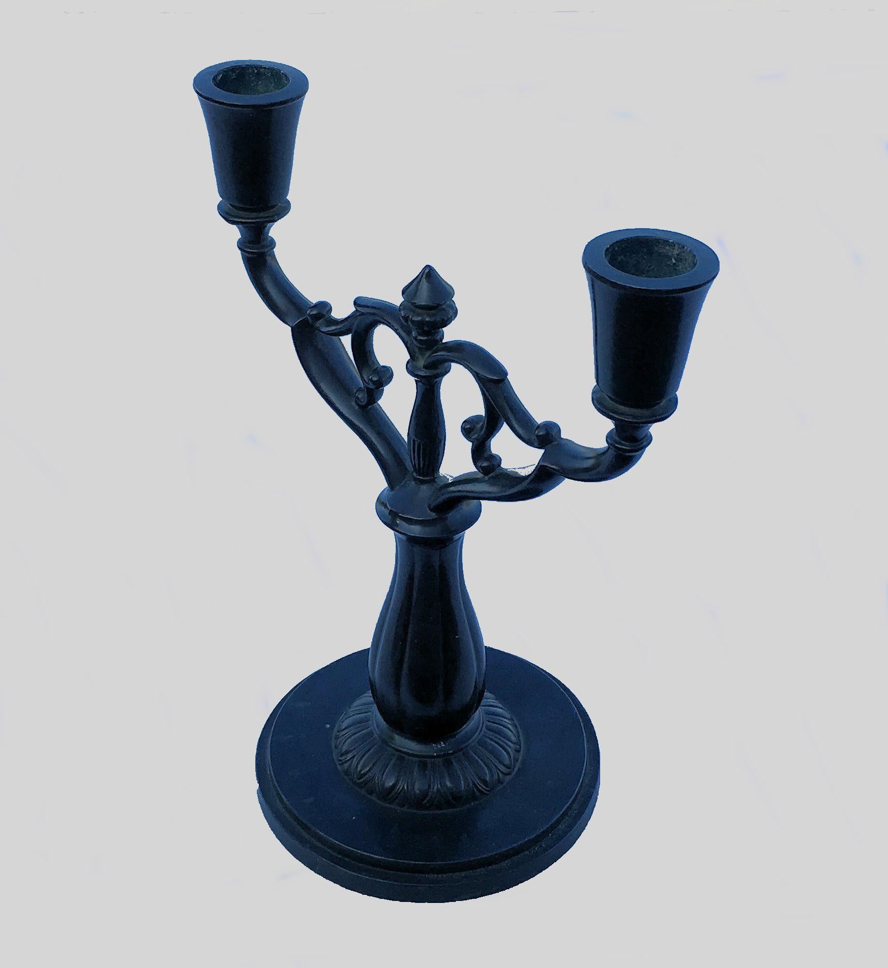 Art Deco Danish two-armed candleholder by Just Andersen in Disko Metal

The candleholder is made in disko metal, an alloy of lead and antimony, which was Andersen's own invention and named after the Disko Bay in Greenland, where he grew up.

The